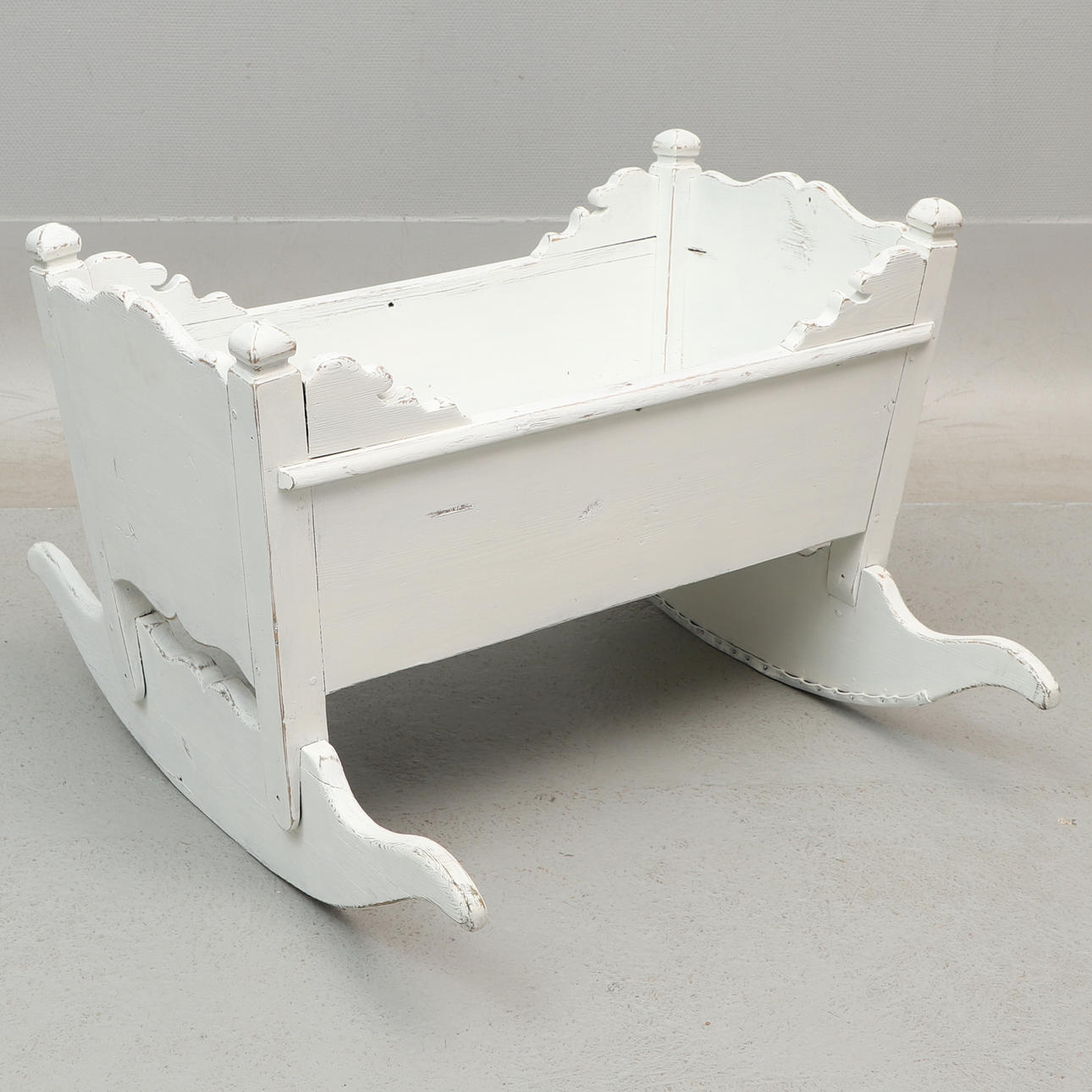 A 19th century painted wooden cradle.