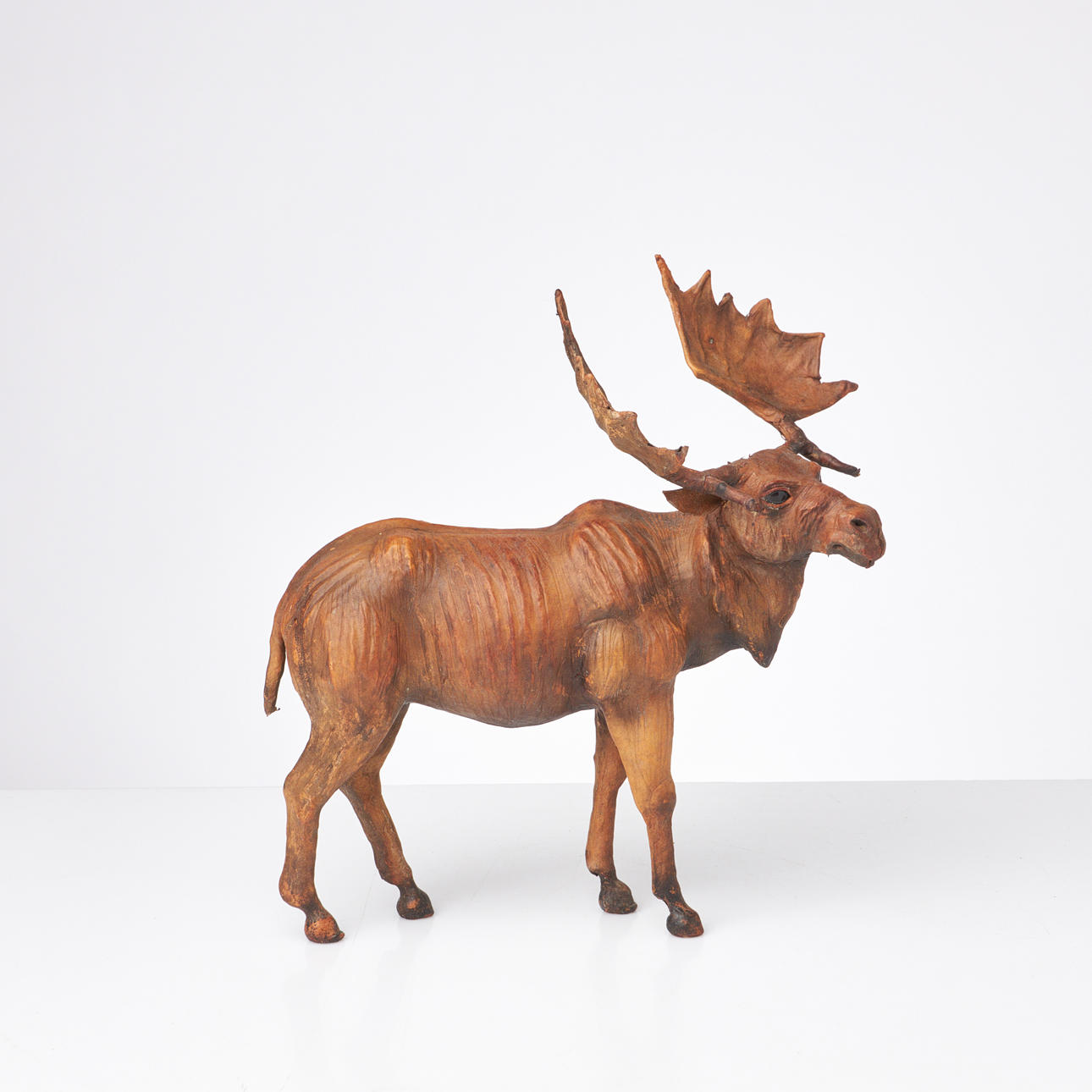 A sculpture, first half of the 20th century, in the form of a moose, dressed with skins.