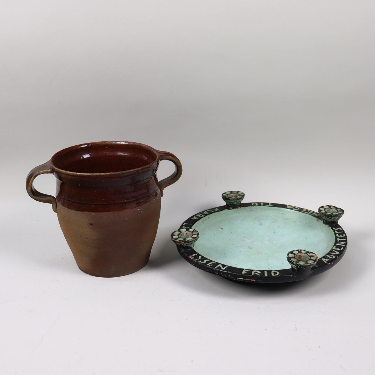 A ceramic mug and an Advent candlestick, 19th century.