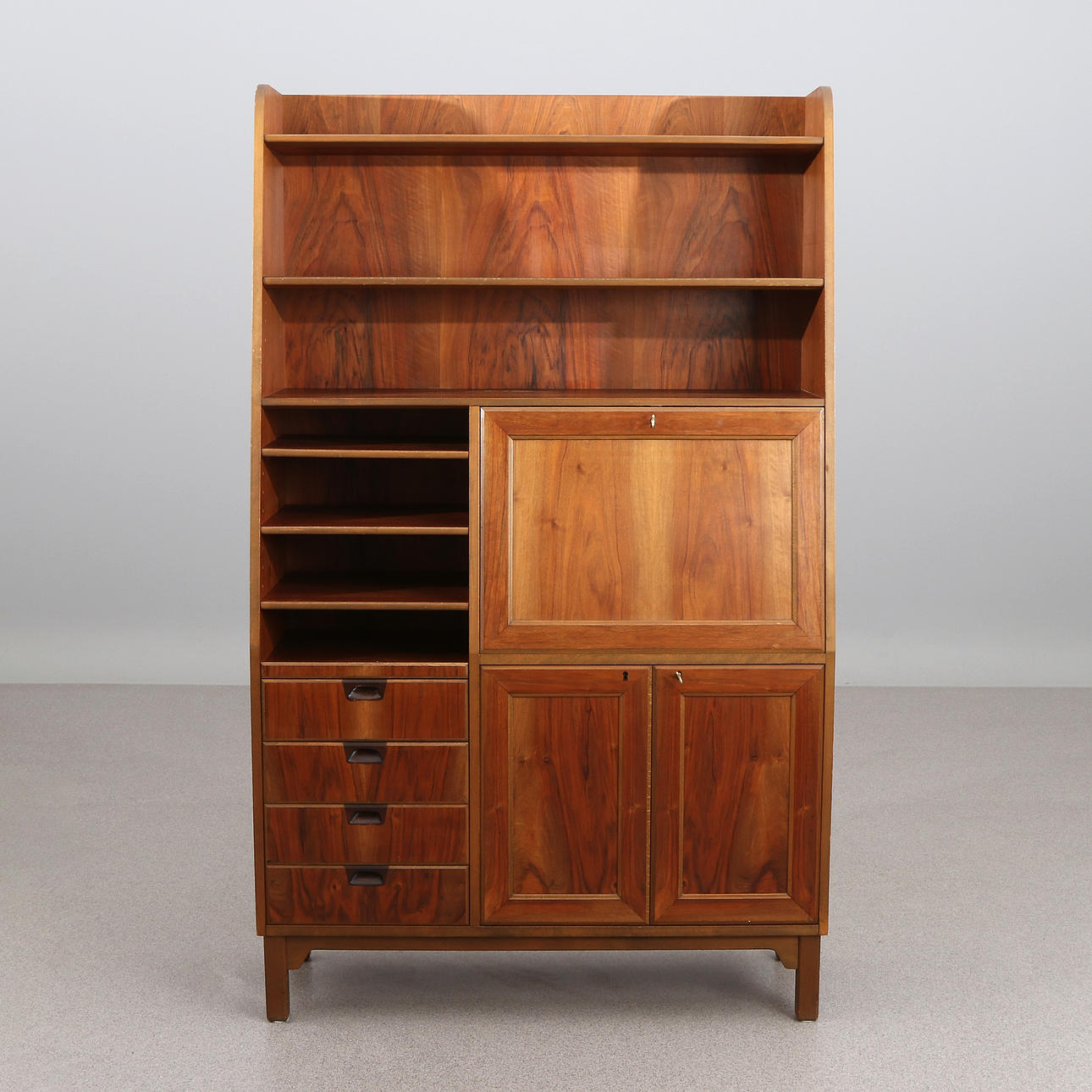 BOOKCASE WITH WRITING INTERIOR. Walnut. 1960s. It's unmarked.