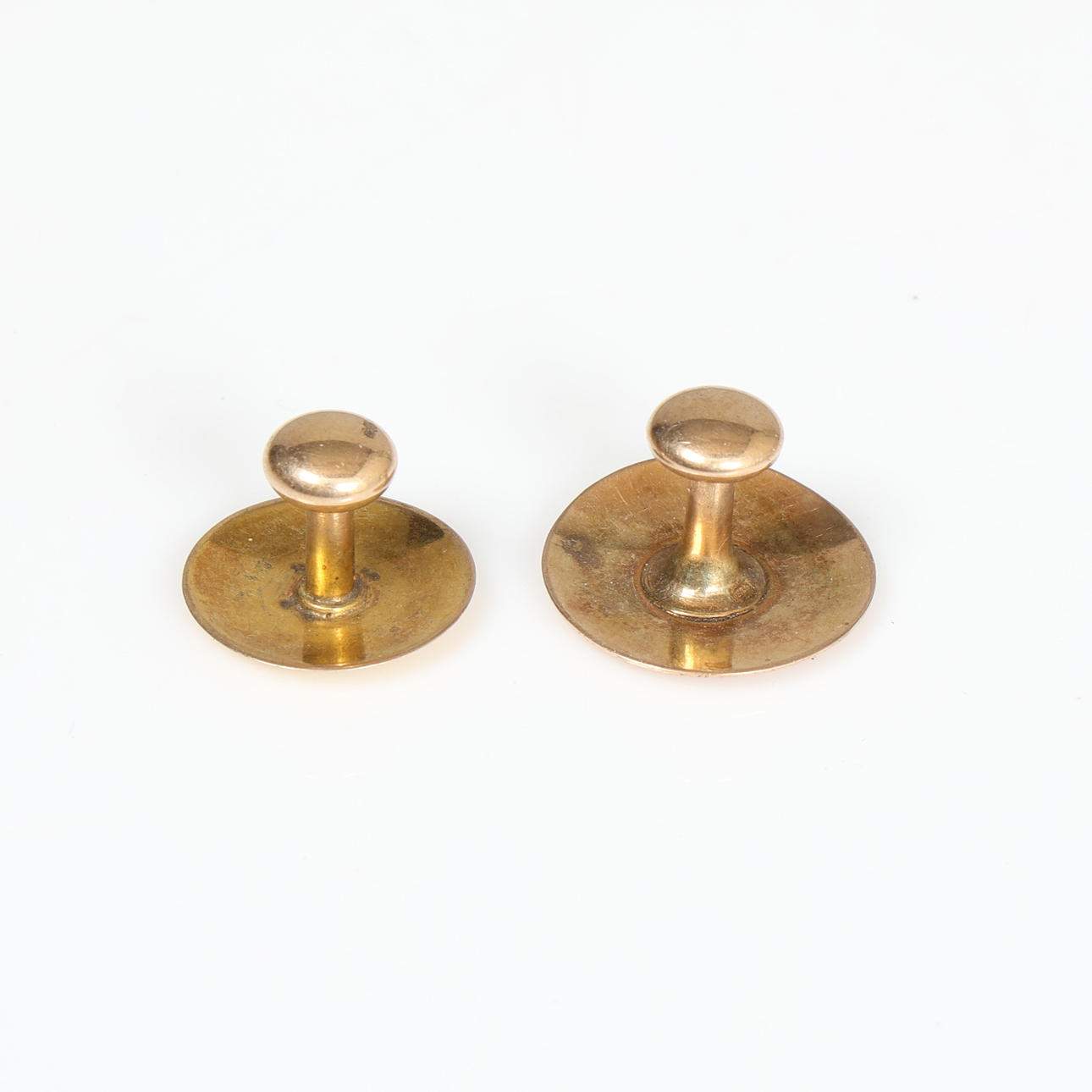 A 9 CARAT GOLD & A 10 CARAT GOLD BUTTON/STUD (2).
