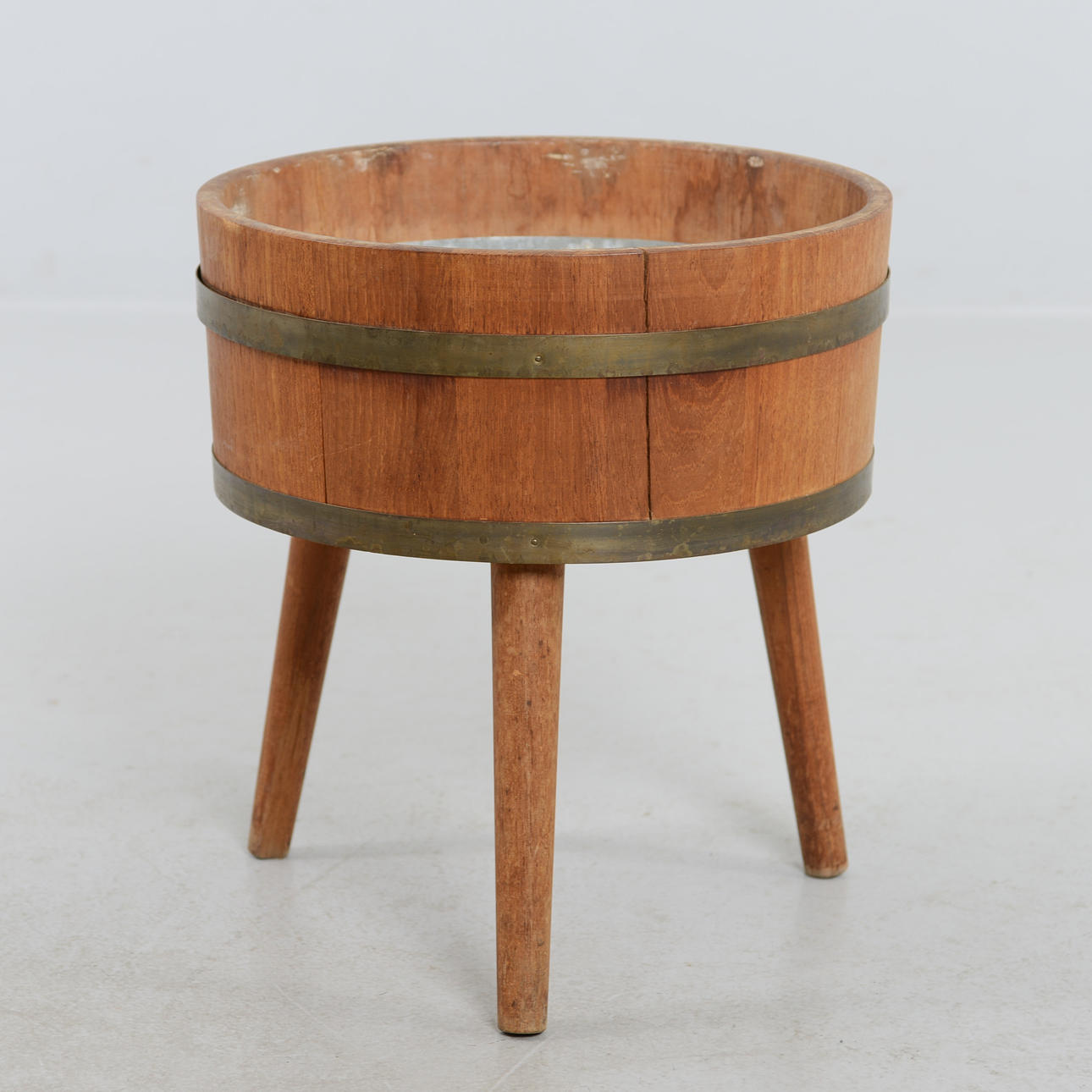 A teak flower table, mid 20th century.