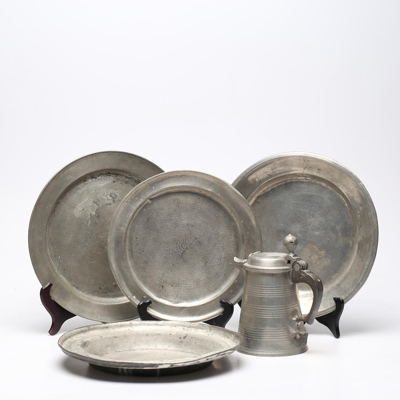 A set of five 19th century pewter objects.