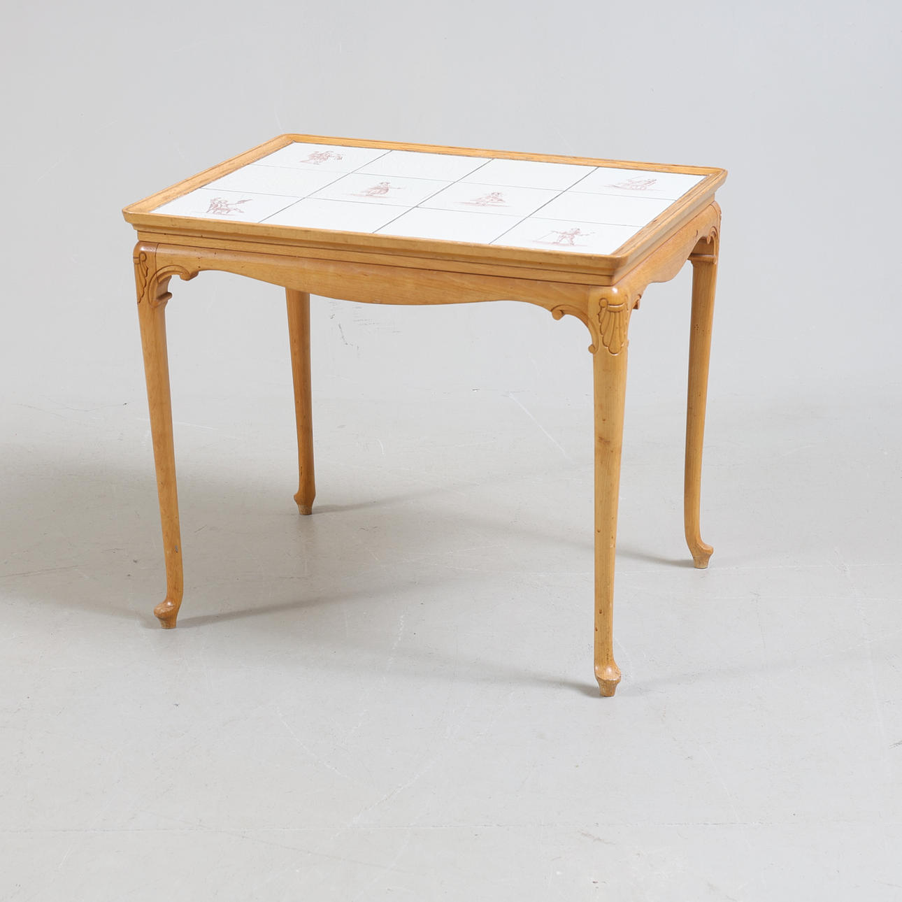 A coffee table, birch and tile, 20th century faience.