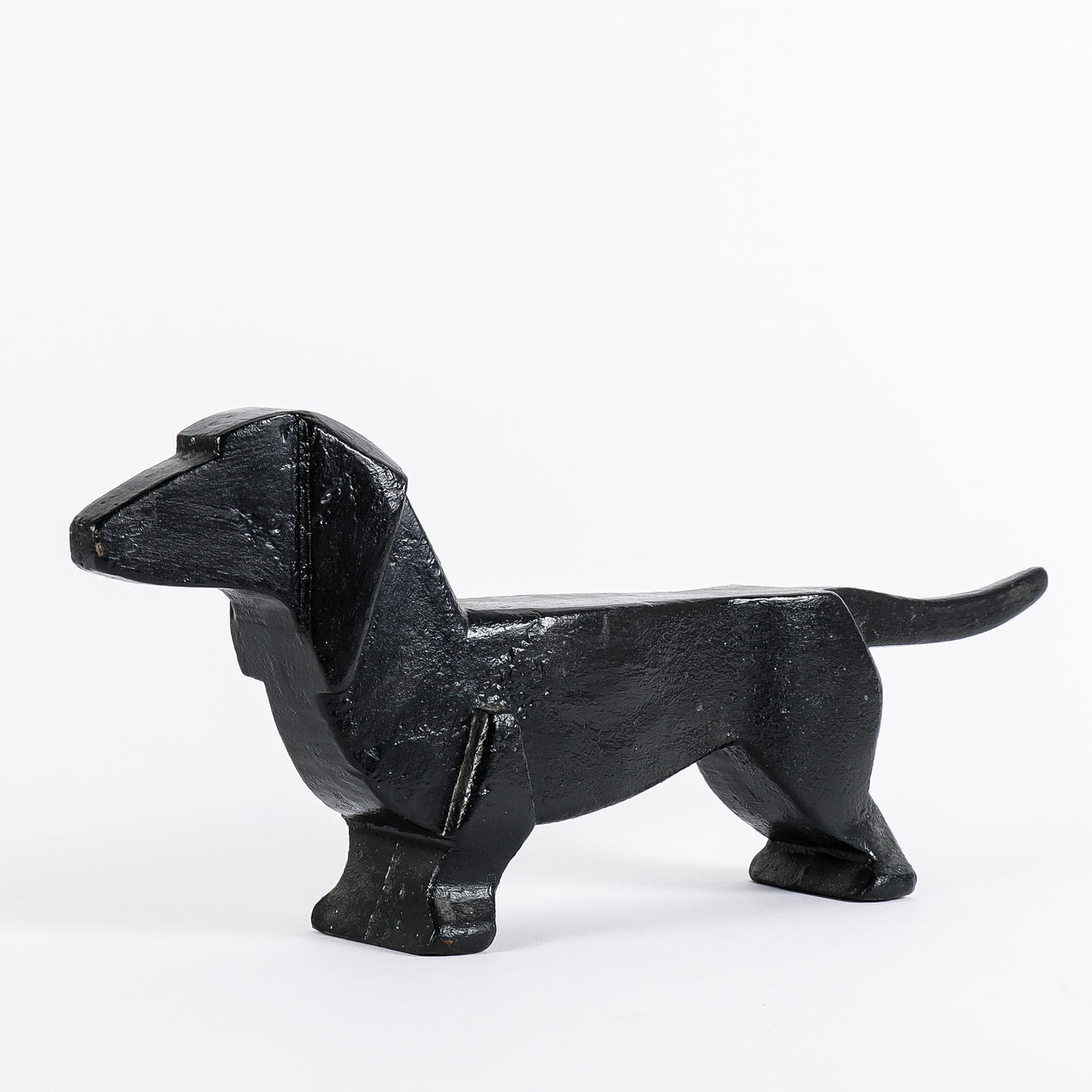 An iron fire dog, 20th century.