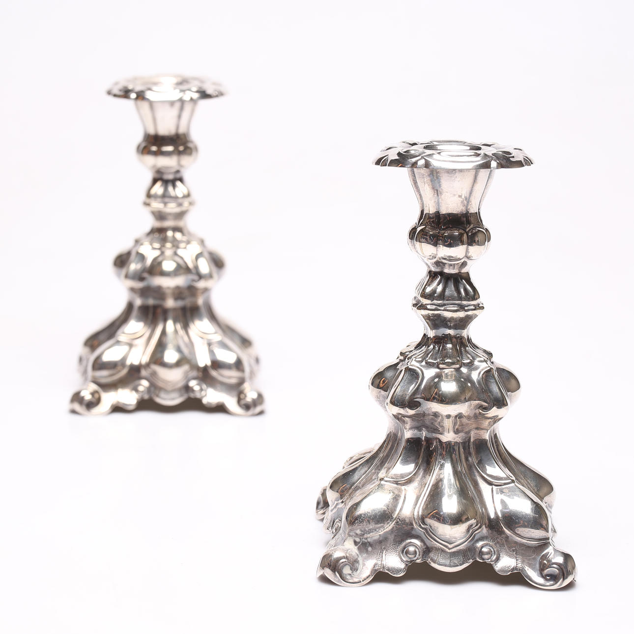 A pair of candlesticks, nickel silver, rococo style.