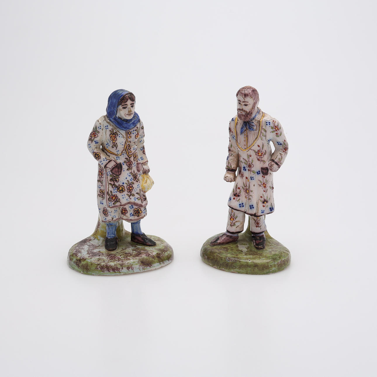 TWO FAIENCE FIGURINES, MONOGRAM SIGNED VR, SECOND HALF OF THE 19TH CENTURY.