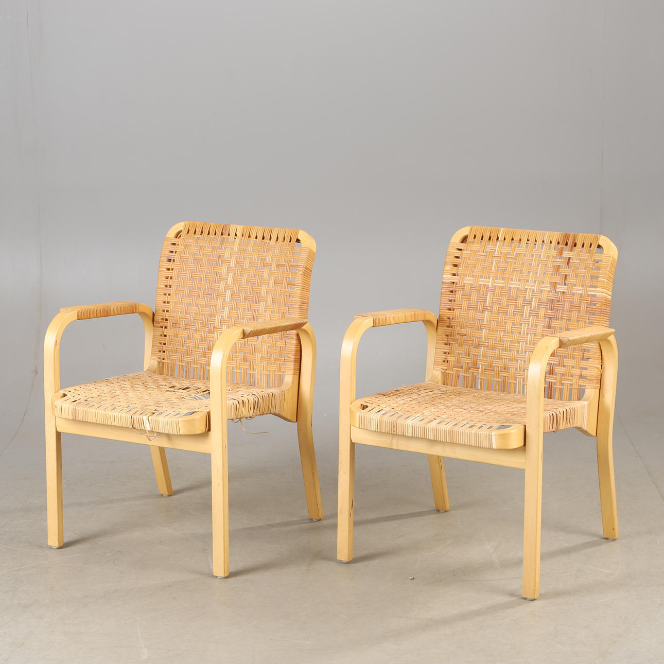 ALVAR AALTO. Armchairs, 1 pair, “NV45", beech and rattan, Artek.