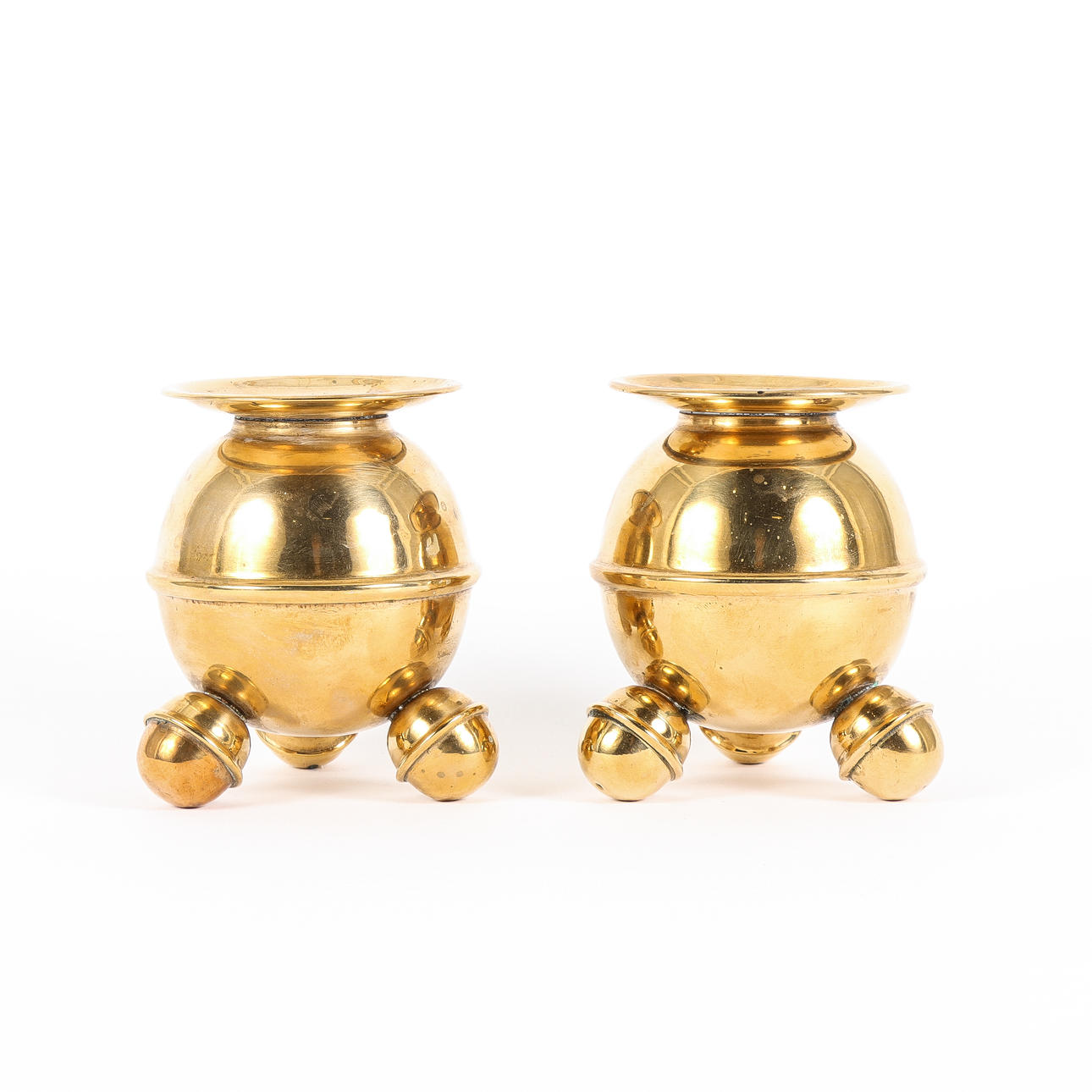 A pair of candlesticks, ball model, brass.
