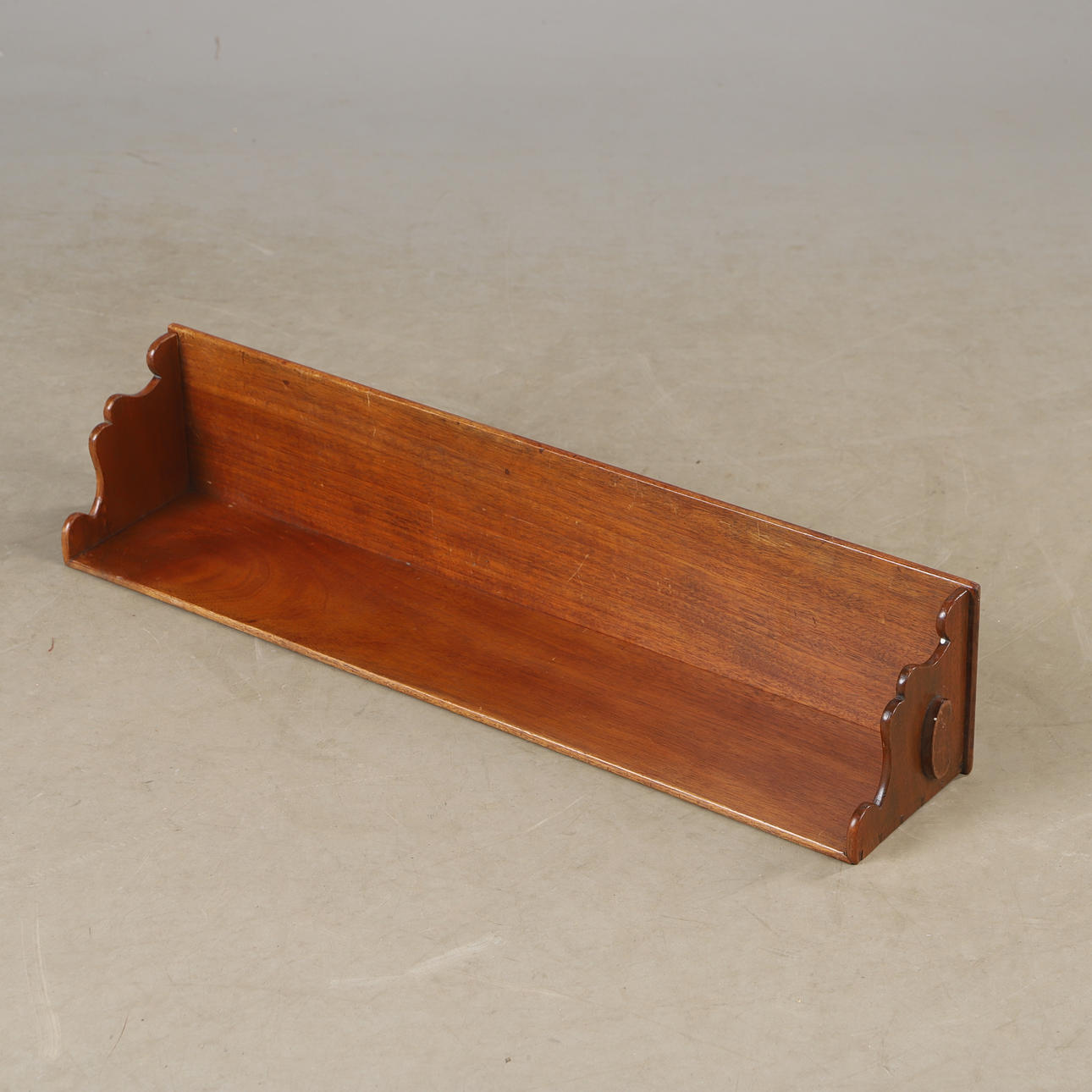A wall shelf, mahogany, 20th century.