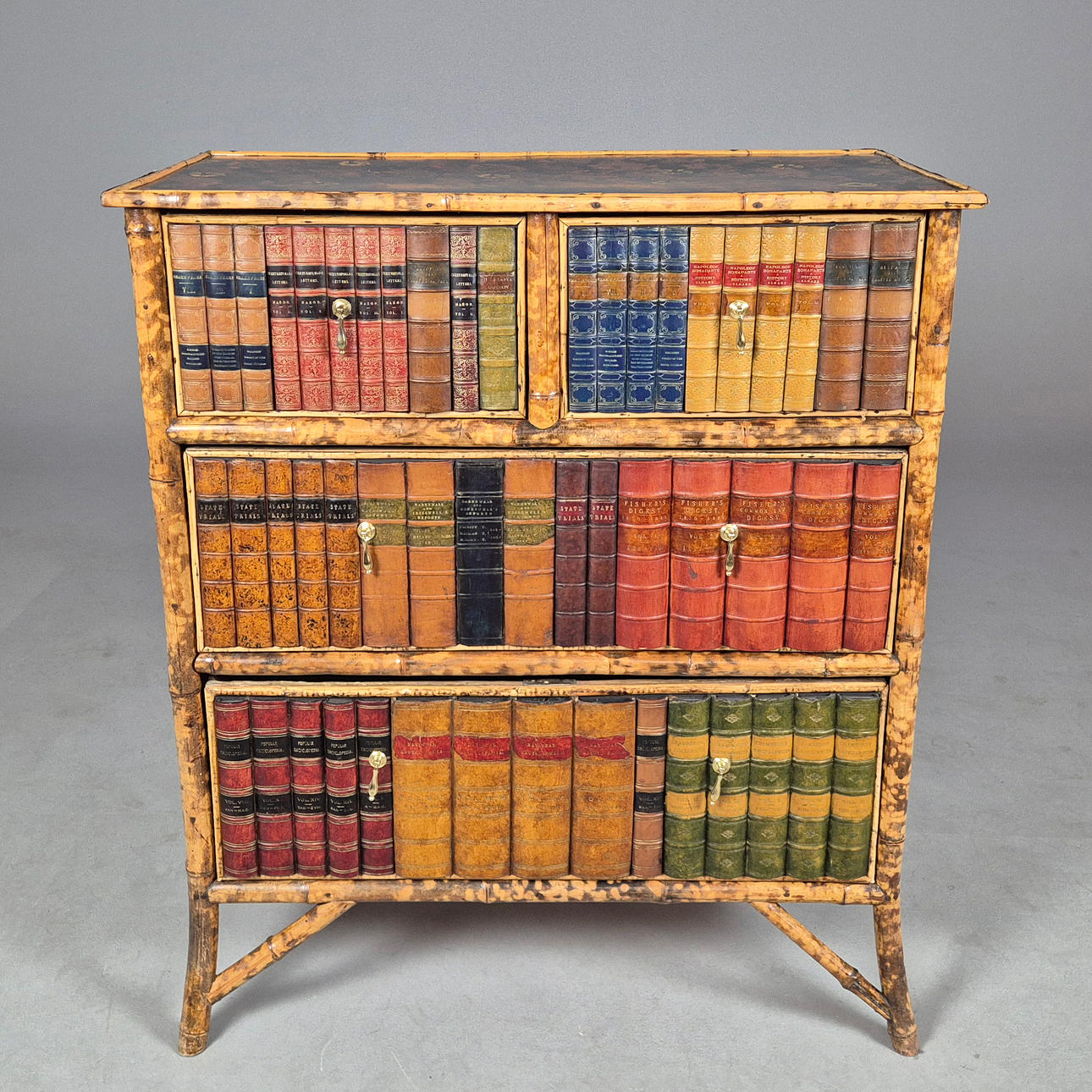 A BAMBOO LACQUER AND FALSE BOOK FRONTED CHEST.