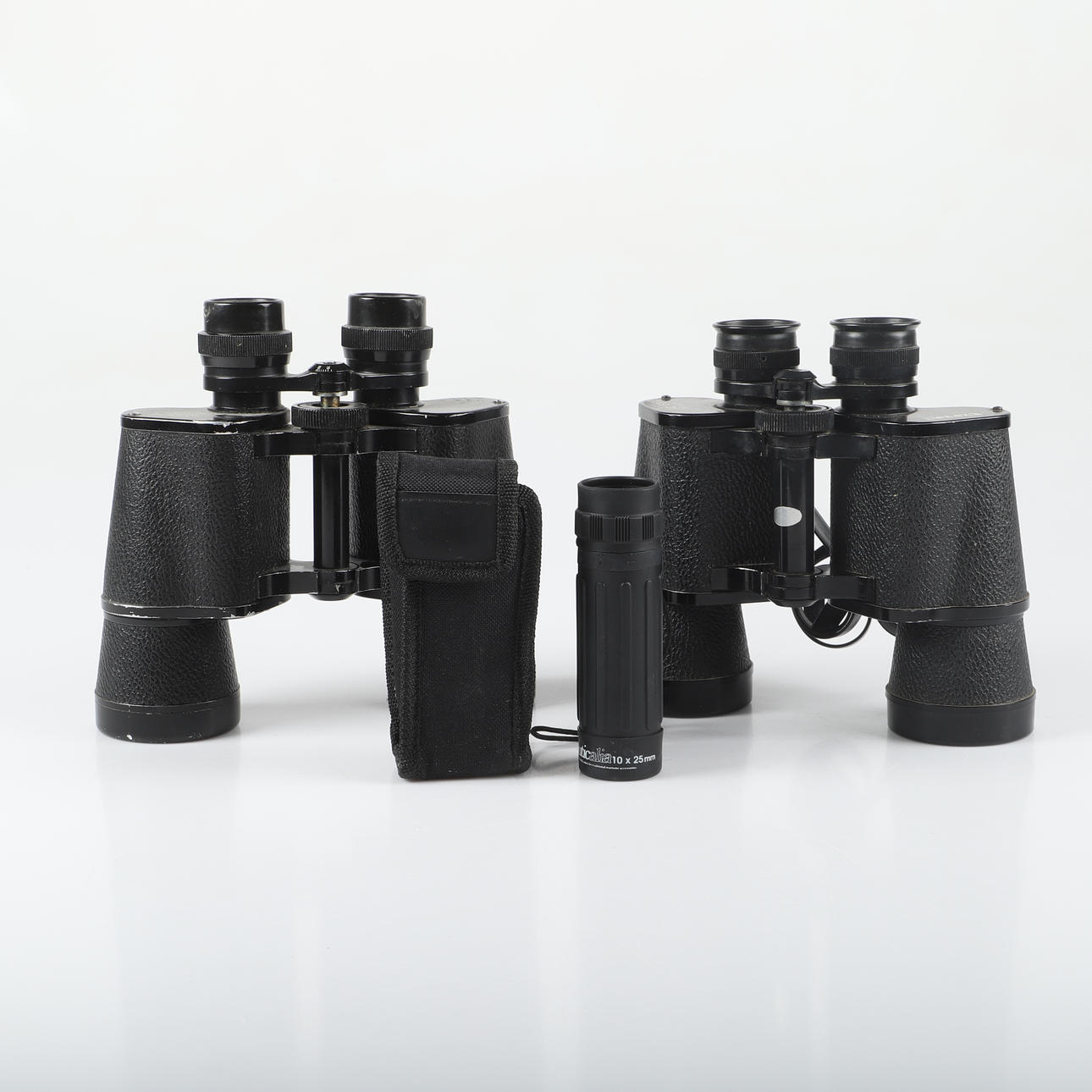 A set of three 20th century binoculars.