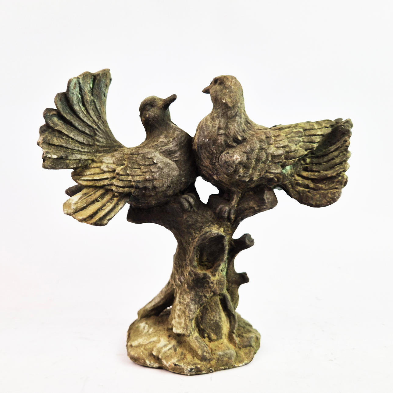 SCULPTURAL PAIR OF TURTLE DOVES ON TREE STUMP.