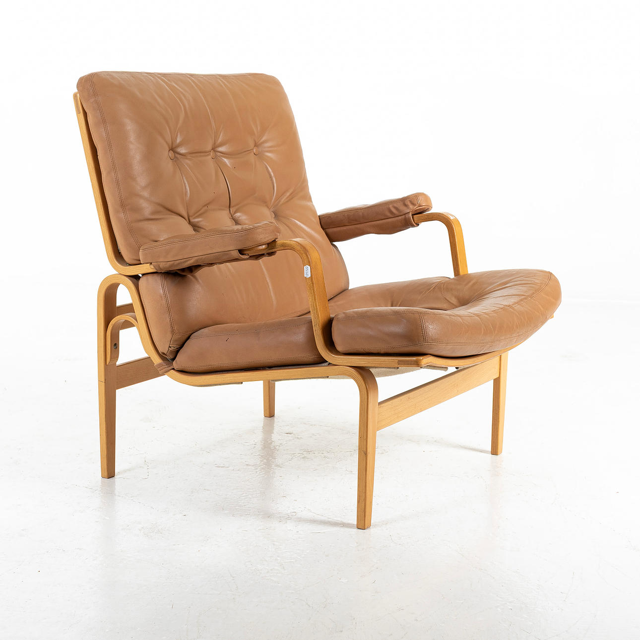 BRUNO MATHSSON. Leather “Ingrid “armchair, Dux.