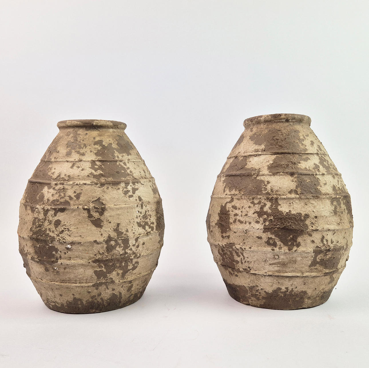 FIBER CLAY VESSELS, A PAIR.