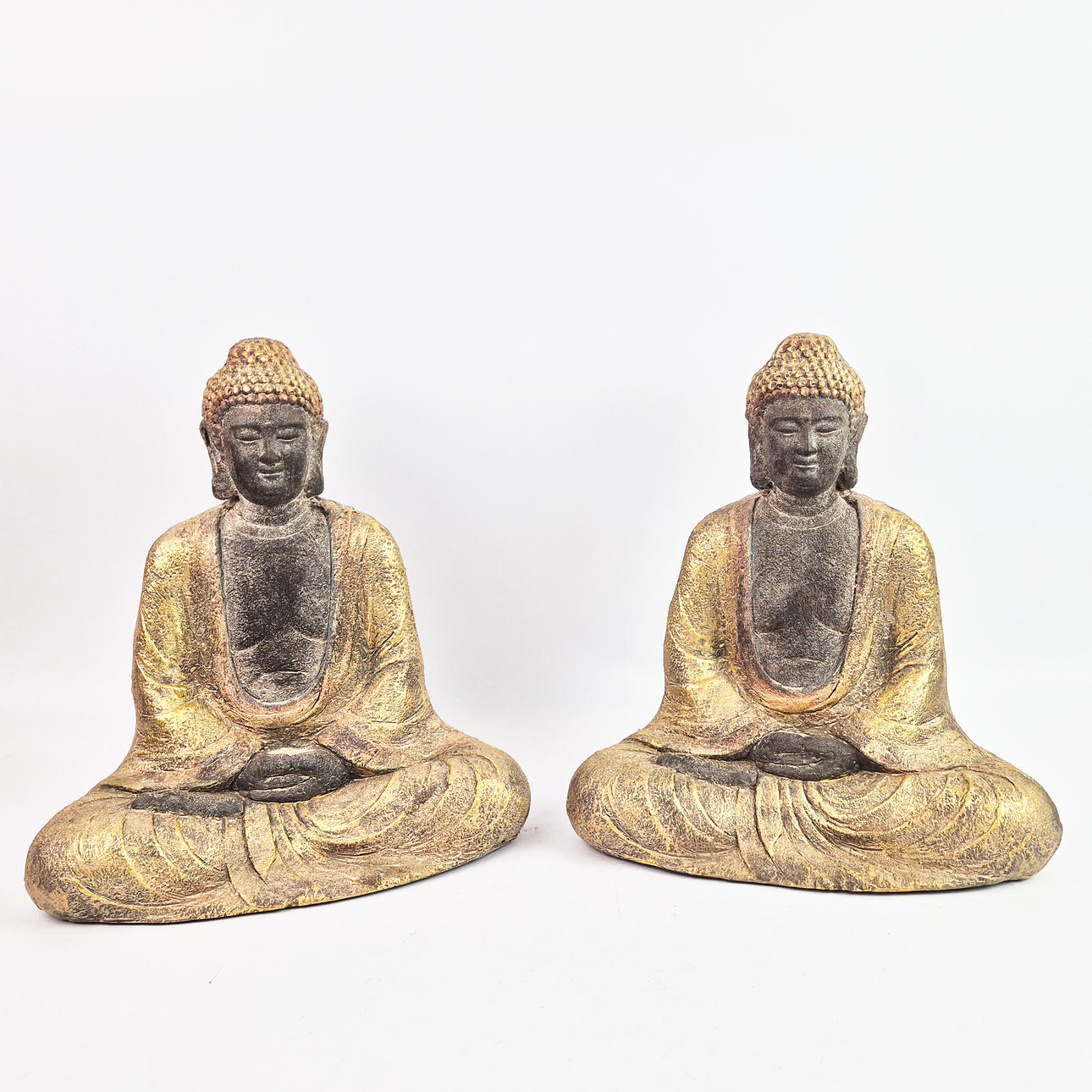 SEATED SCULPTURAL BUDDAHS, A PAIR.
