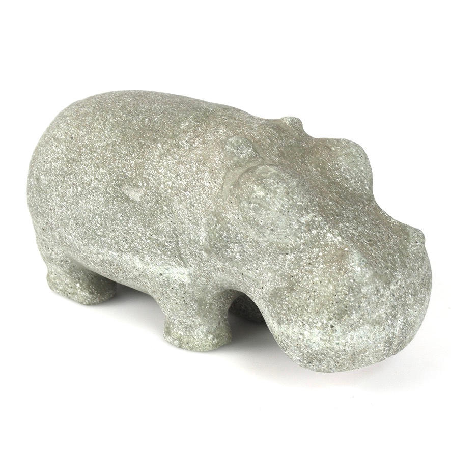 En stenfigur af en flodhest.