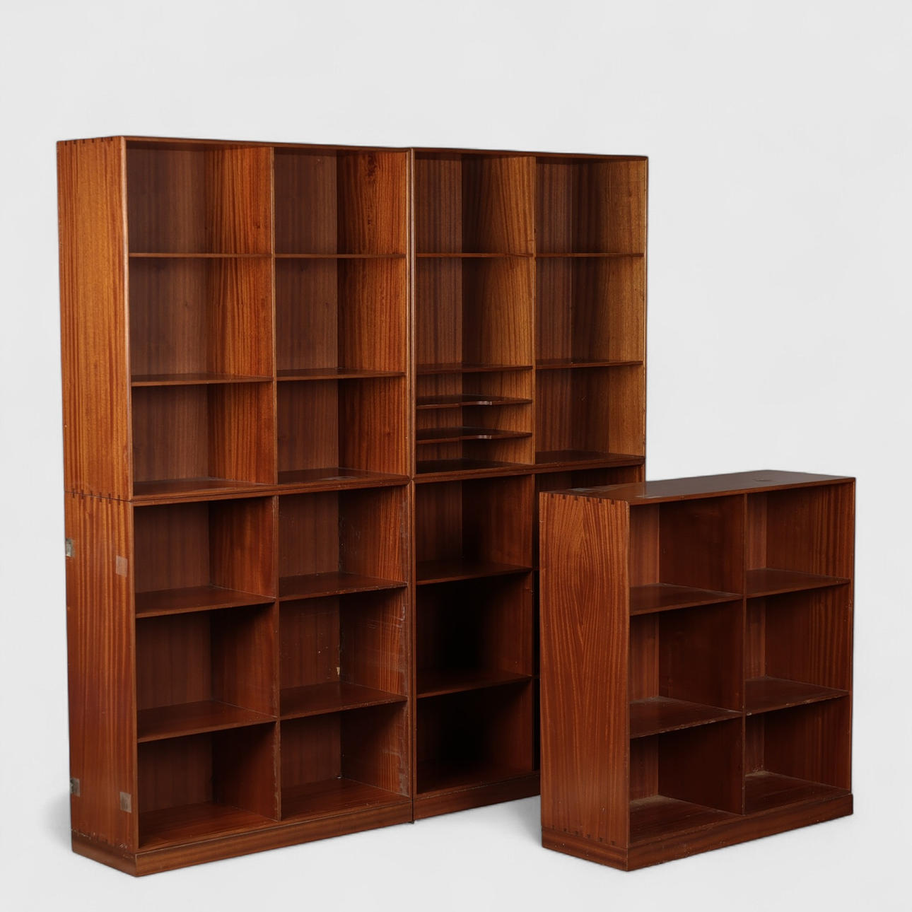 MOGENS KOCH. Solid mahogany bookcase wall, five bookcases and three plinths, Rud. Rasmussens Joinery, Denmark, (5+3).