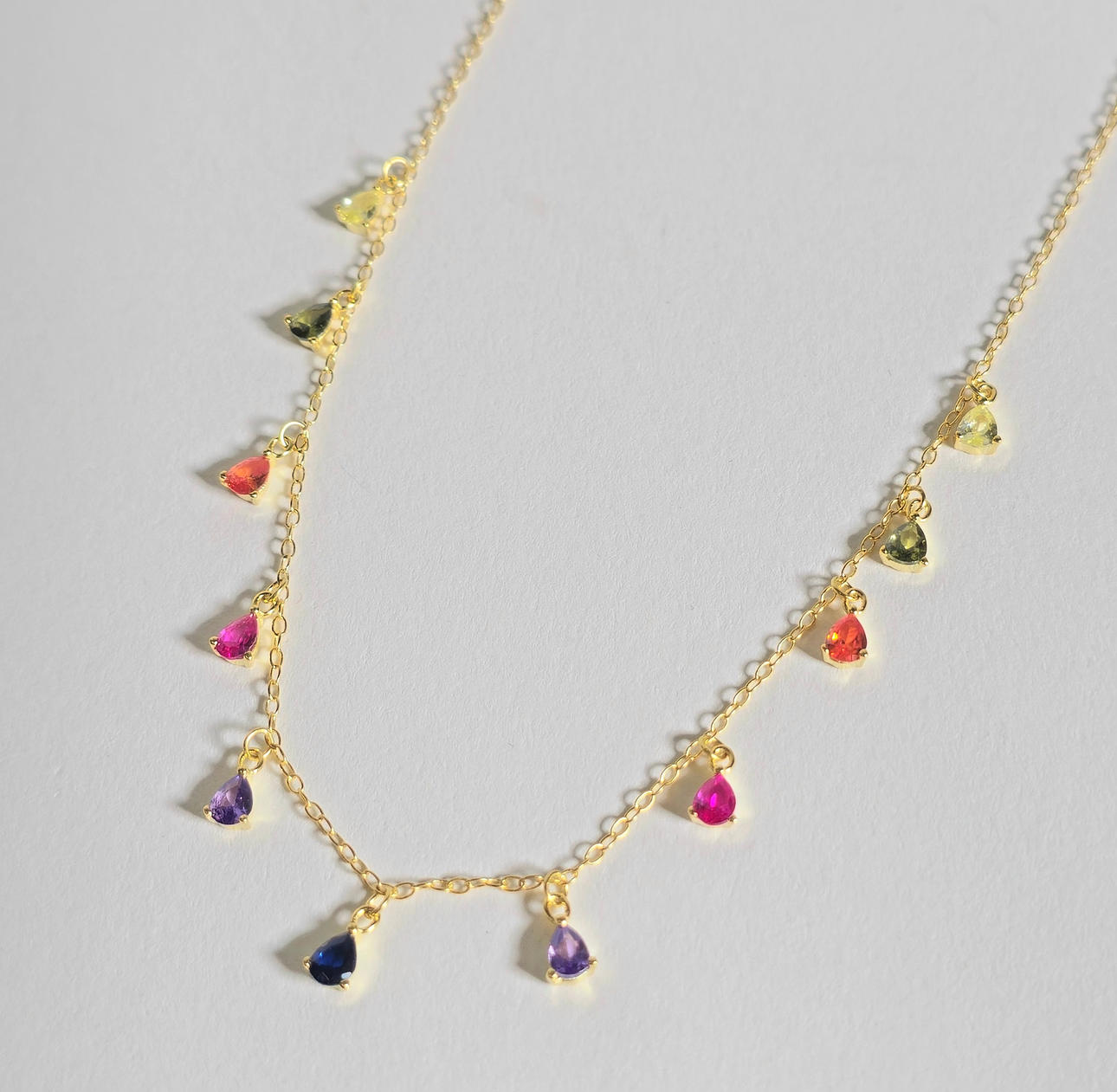 GOLD-PLATED SILVER CHAIN WITH COLORED ZIRCONS.