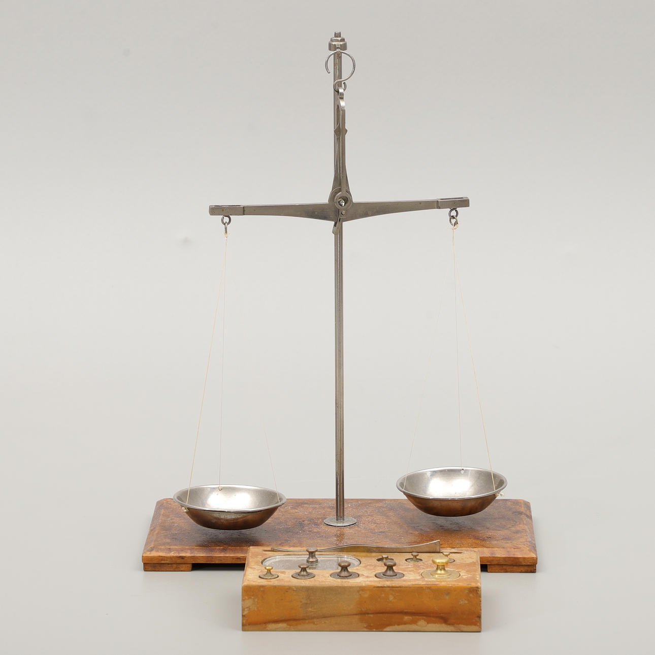 A 19th century gold scale with weights.