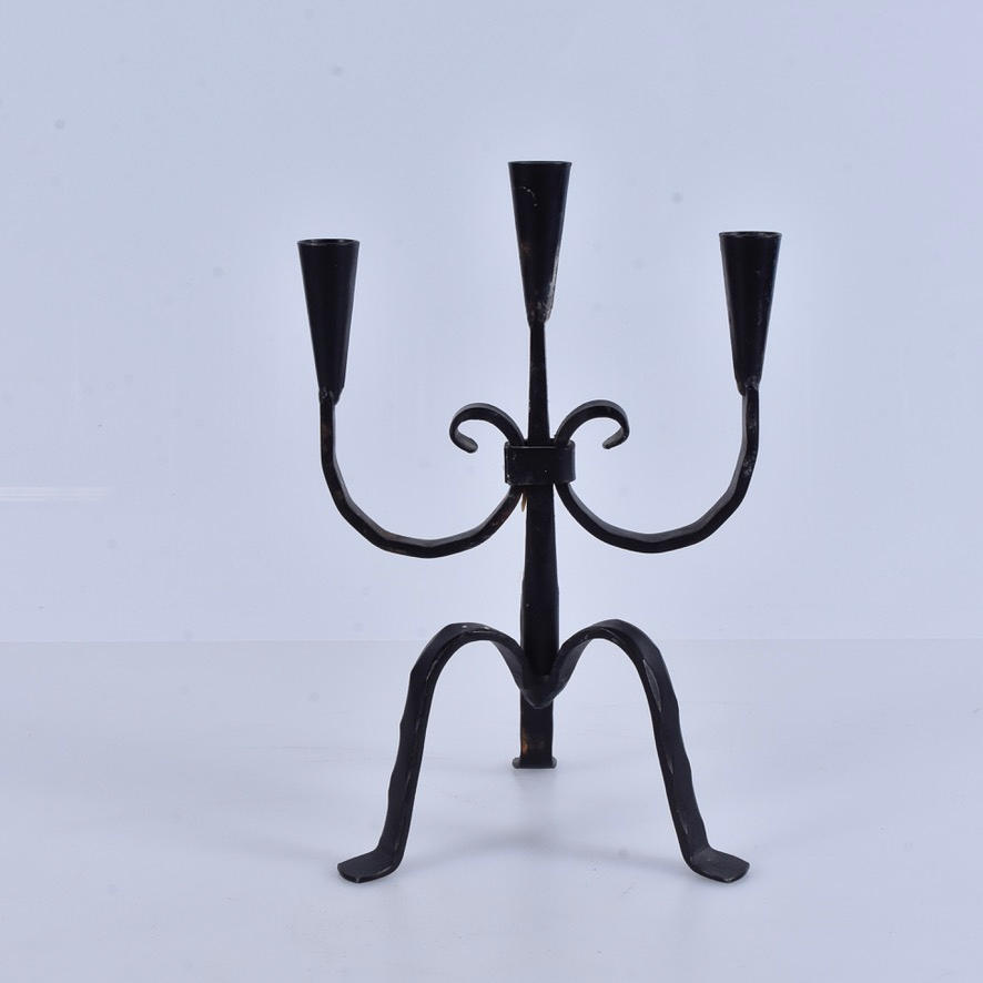 A wrought iron candelabra, 20th century.
