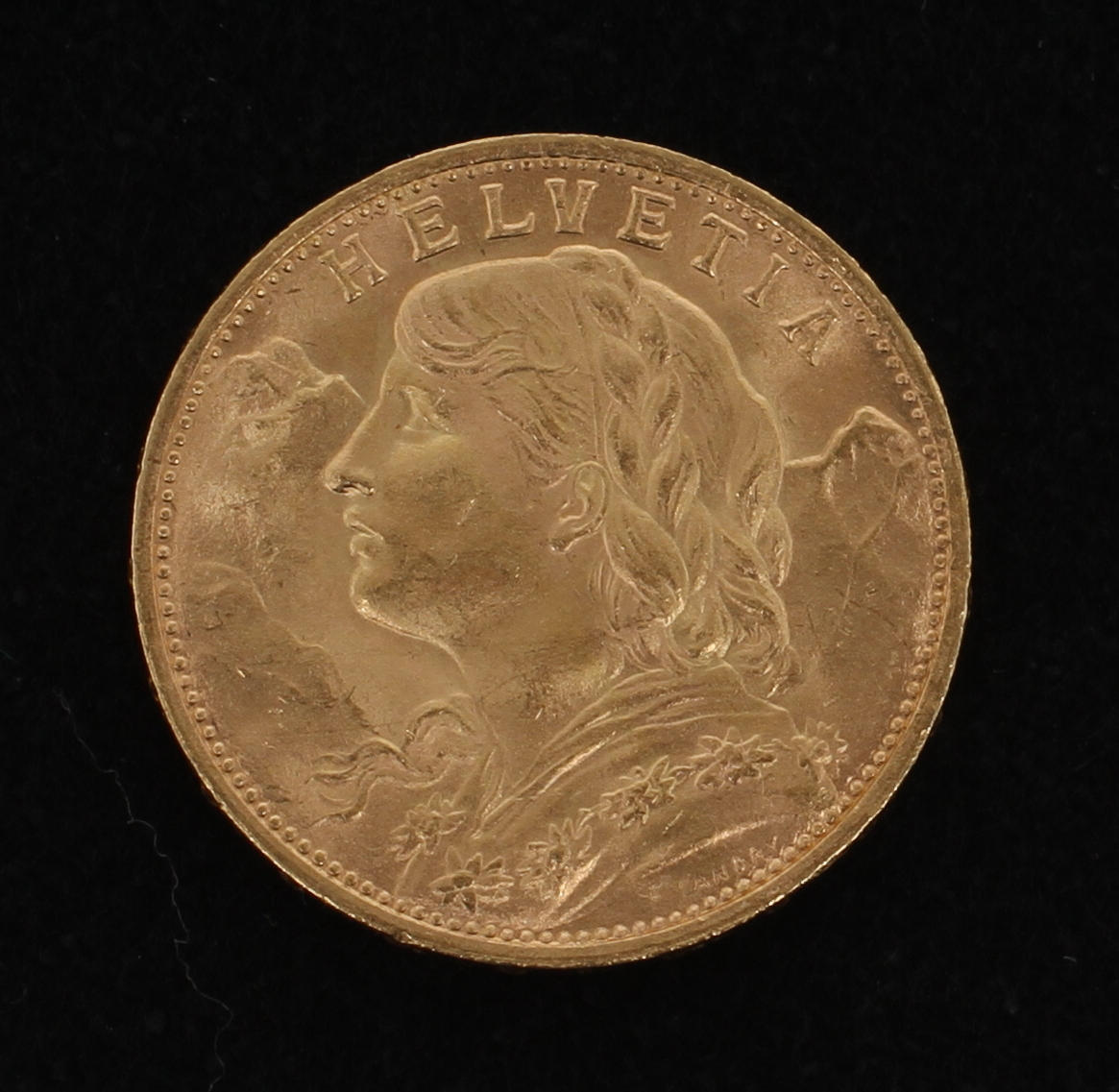 GULDMYT, Schweiz 20 franc (Vreneli) 1927, 21,6k guld. Vikt 6,3 gram.