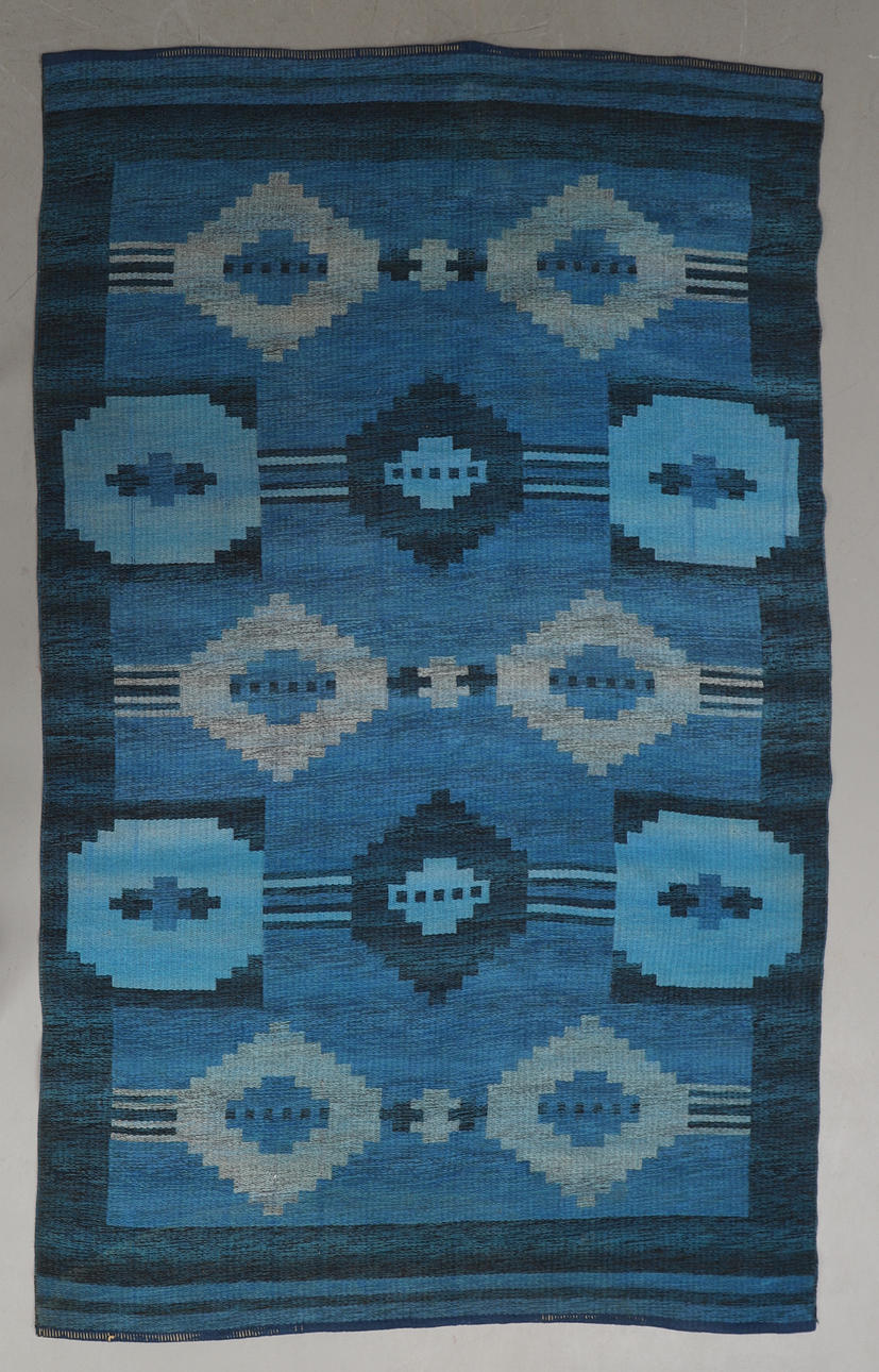 A RUG, wicker, 232 x 150 cm.
