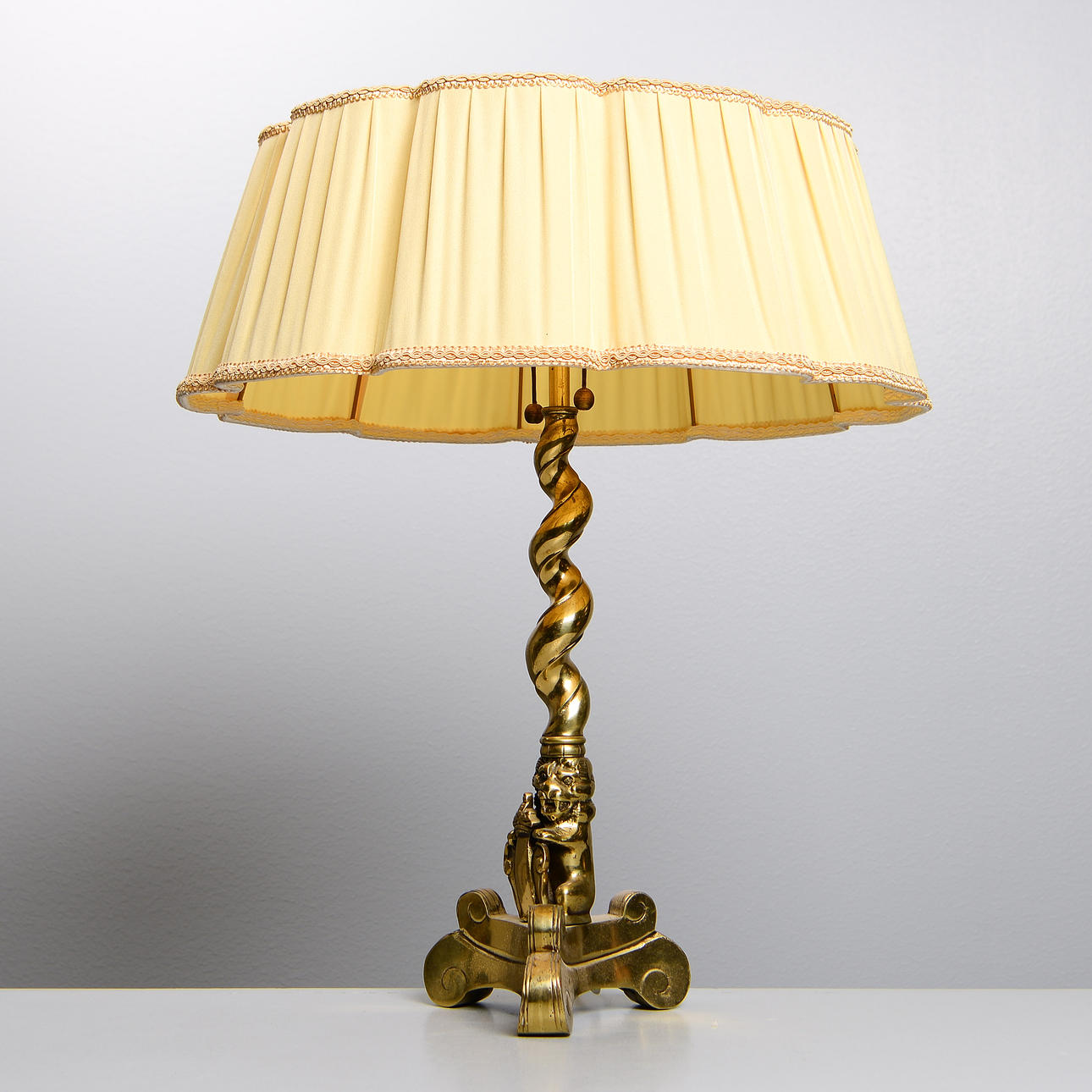 A baroque brass table lamp, probably 1940s.