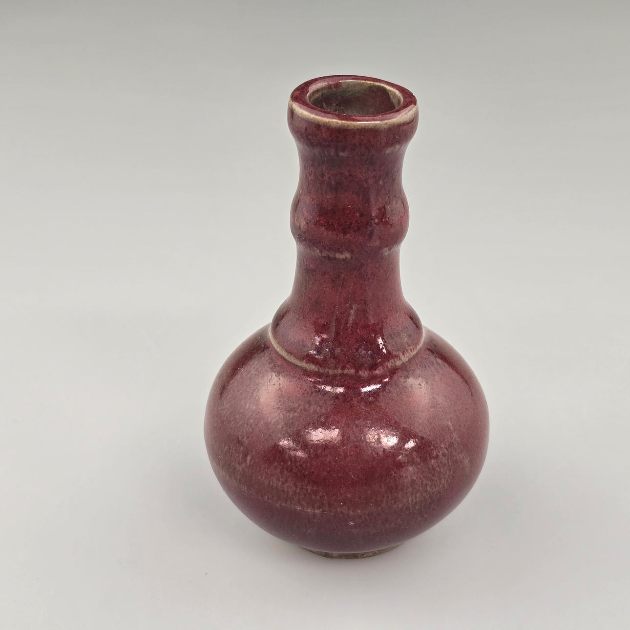 Small narrow-necked vase - China, dark red glaze.