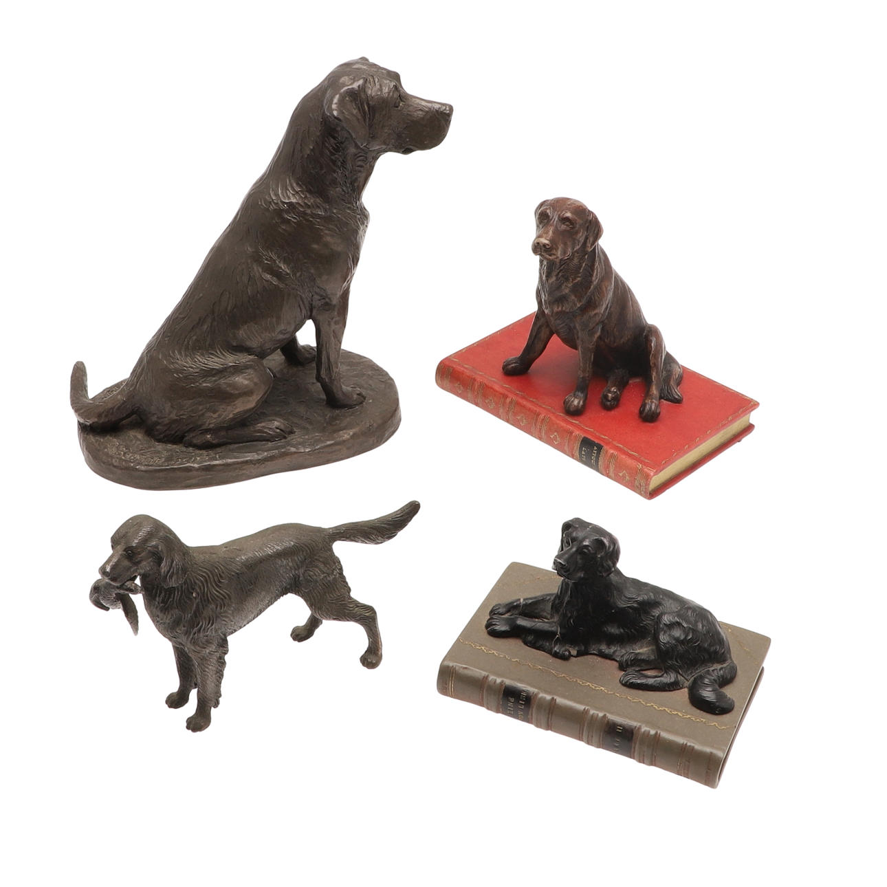 FOUR MODERN BRONZED DOG SCULPTURES.