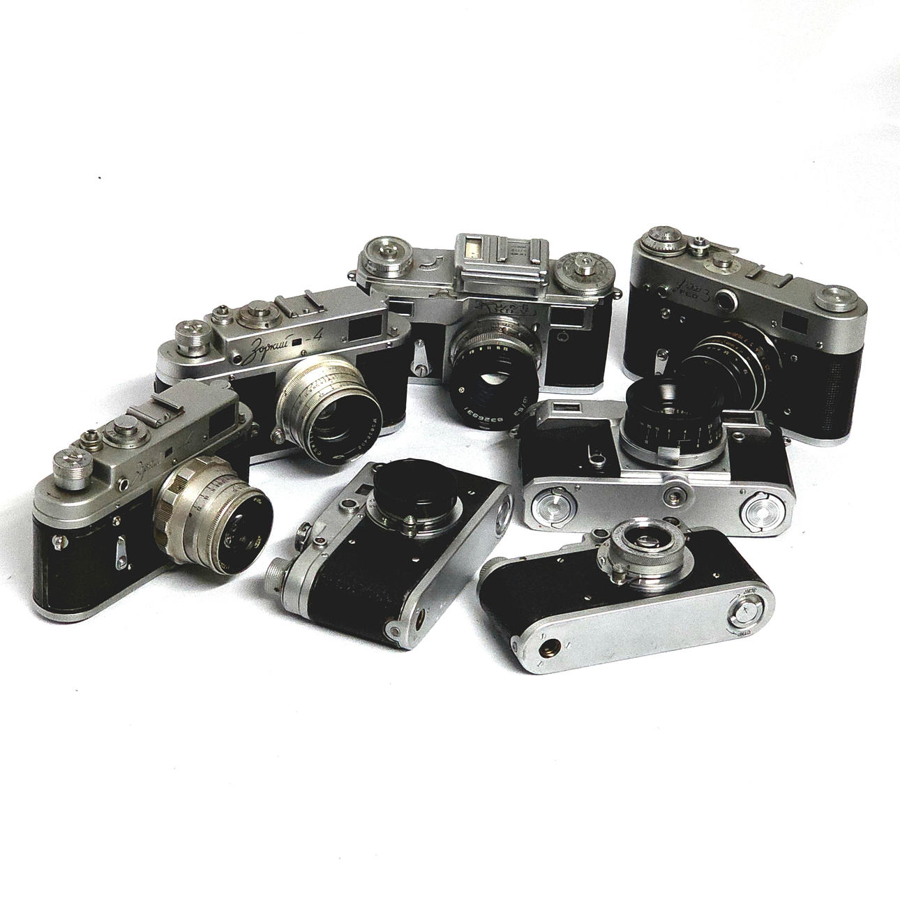 Collection of seven Zorki cameras of different models.