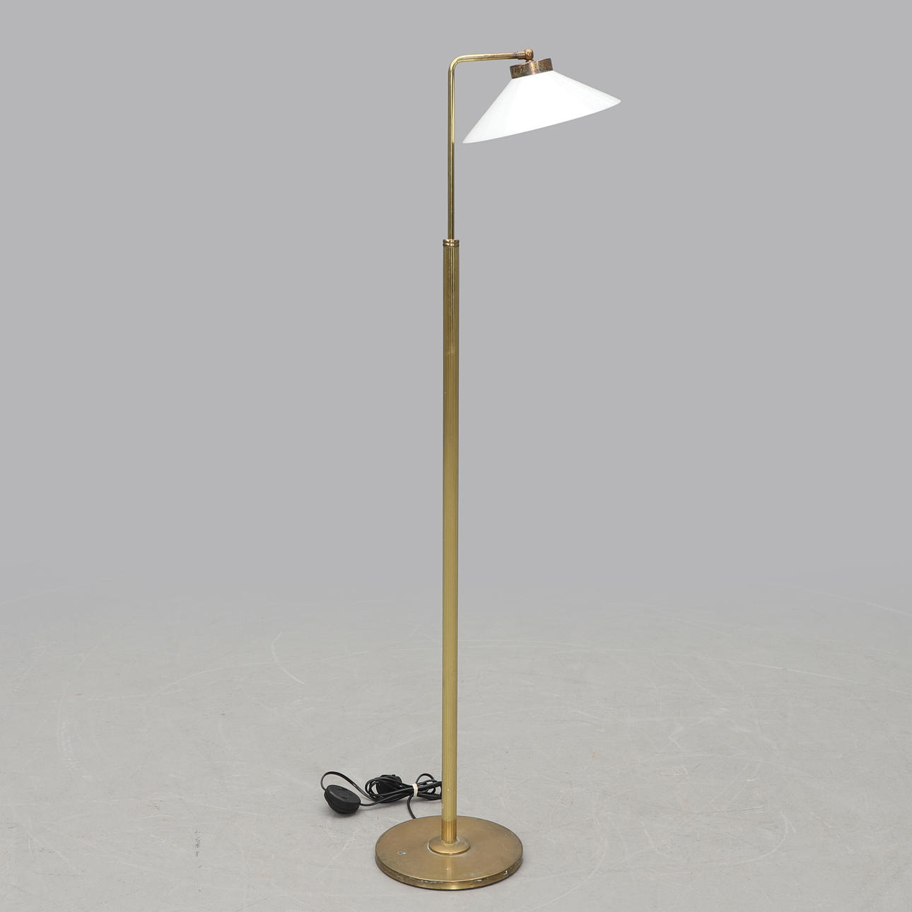 A 20th-century brass floor lamp.