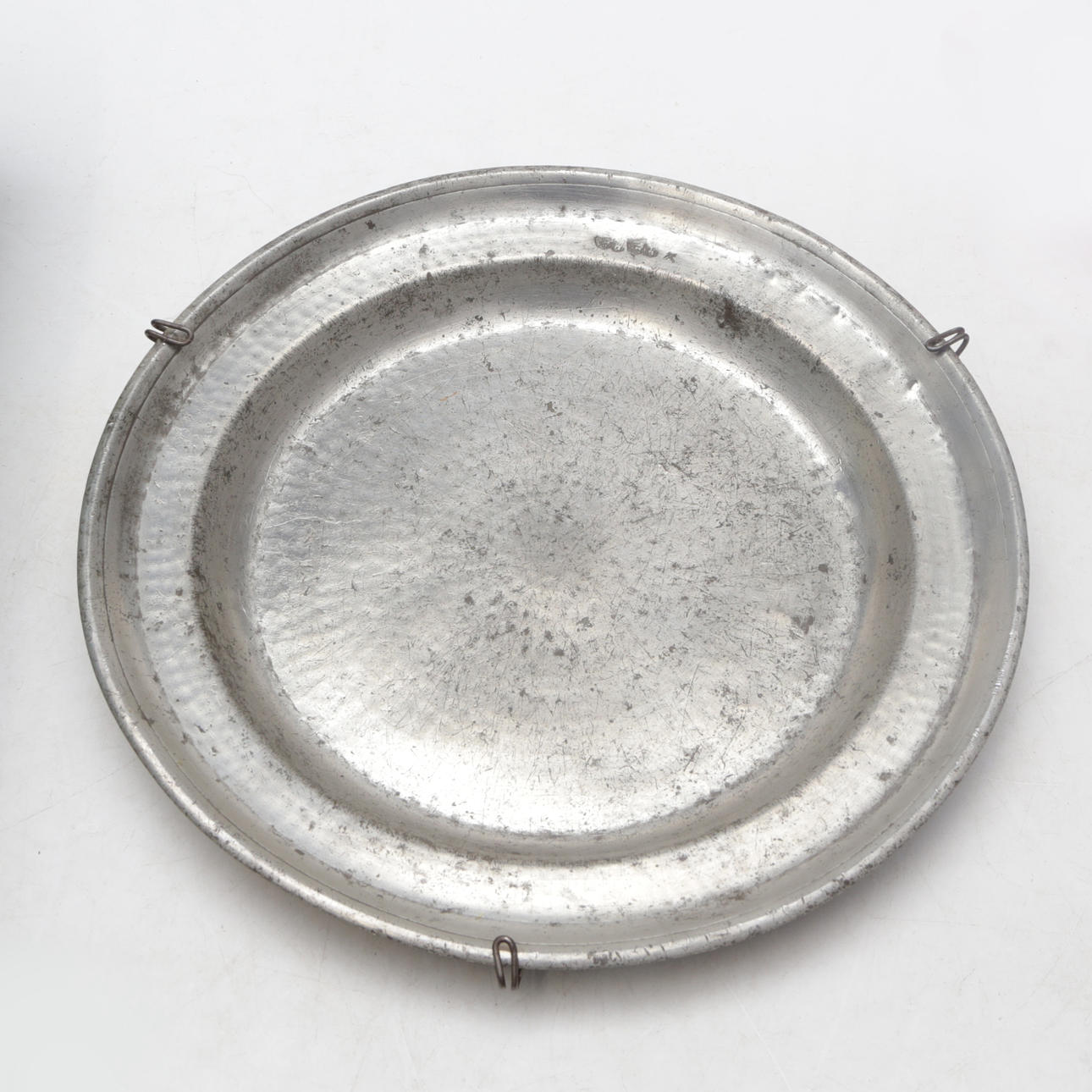 A 19th century pewter platter.