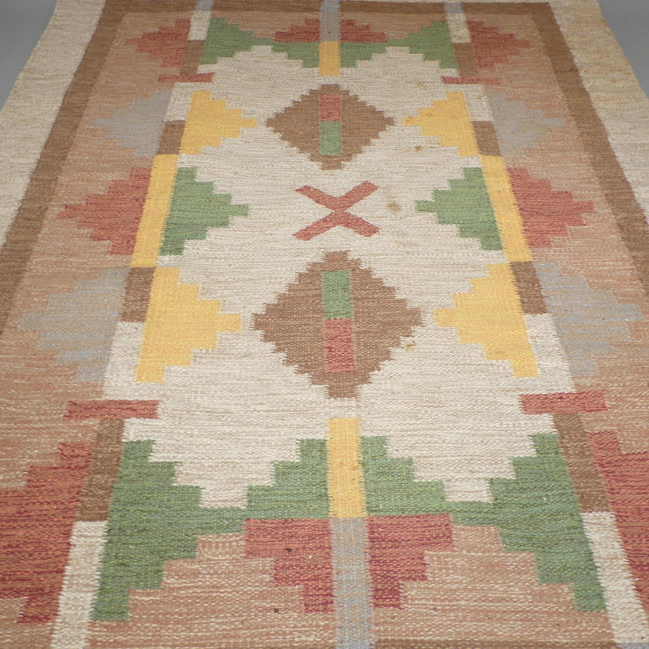 IDA RYDELIUS. carpet, wicker, signed IR.