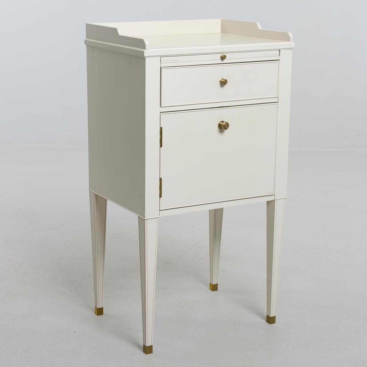 A Gustavian style bedside table, “Västra Ny”, from IKEA's 18th century series.