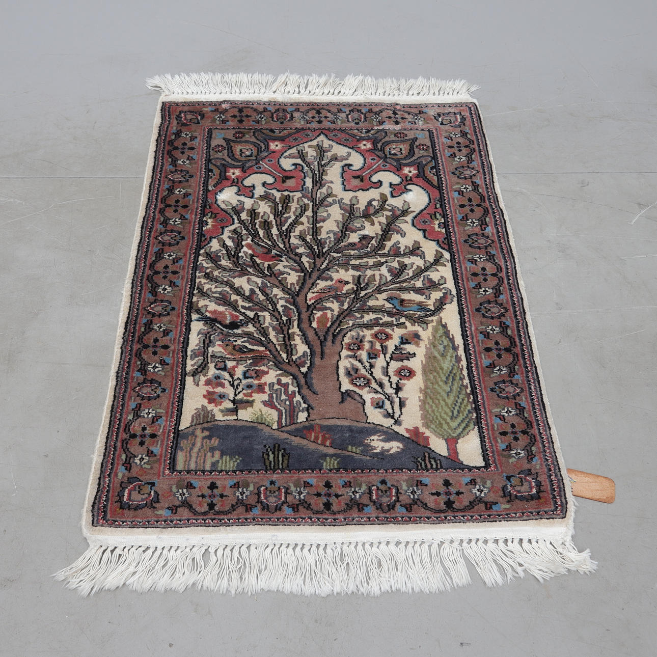 A silk carpet, Pakistan. Approx. 65x90 cm.