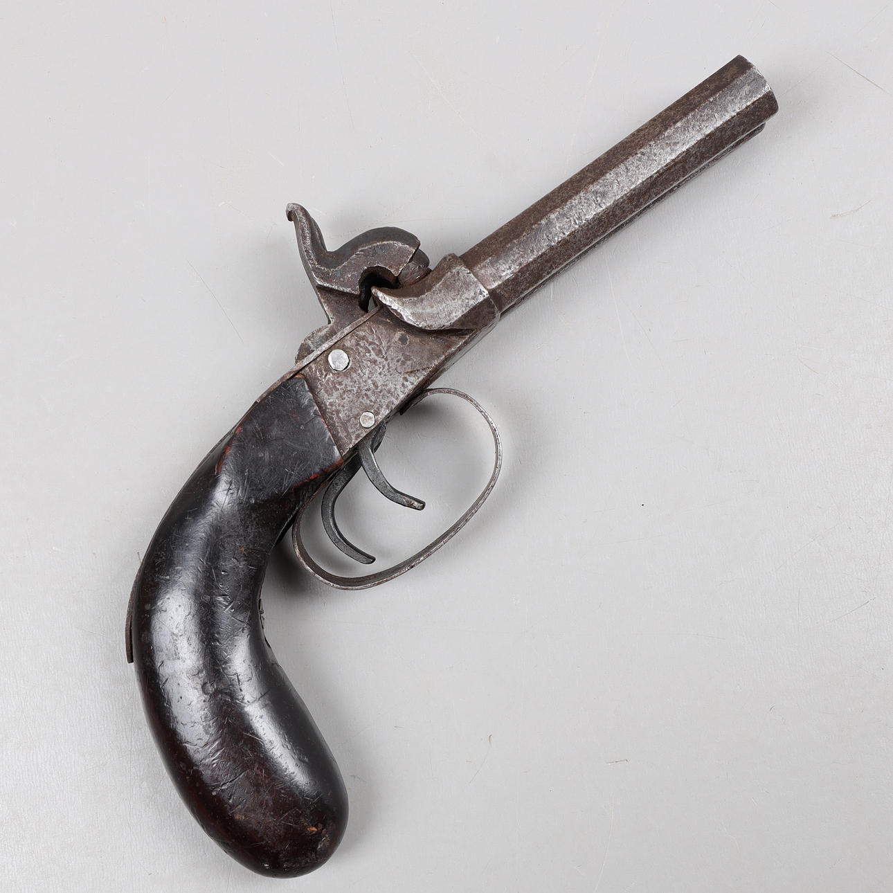 A PISTOL, double octagonal barrel, 19th century.