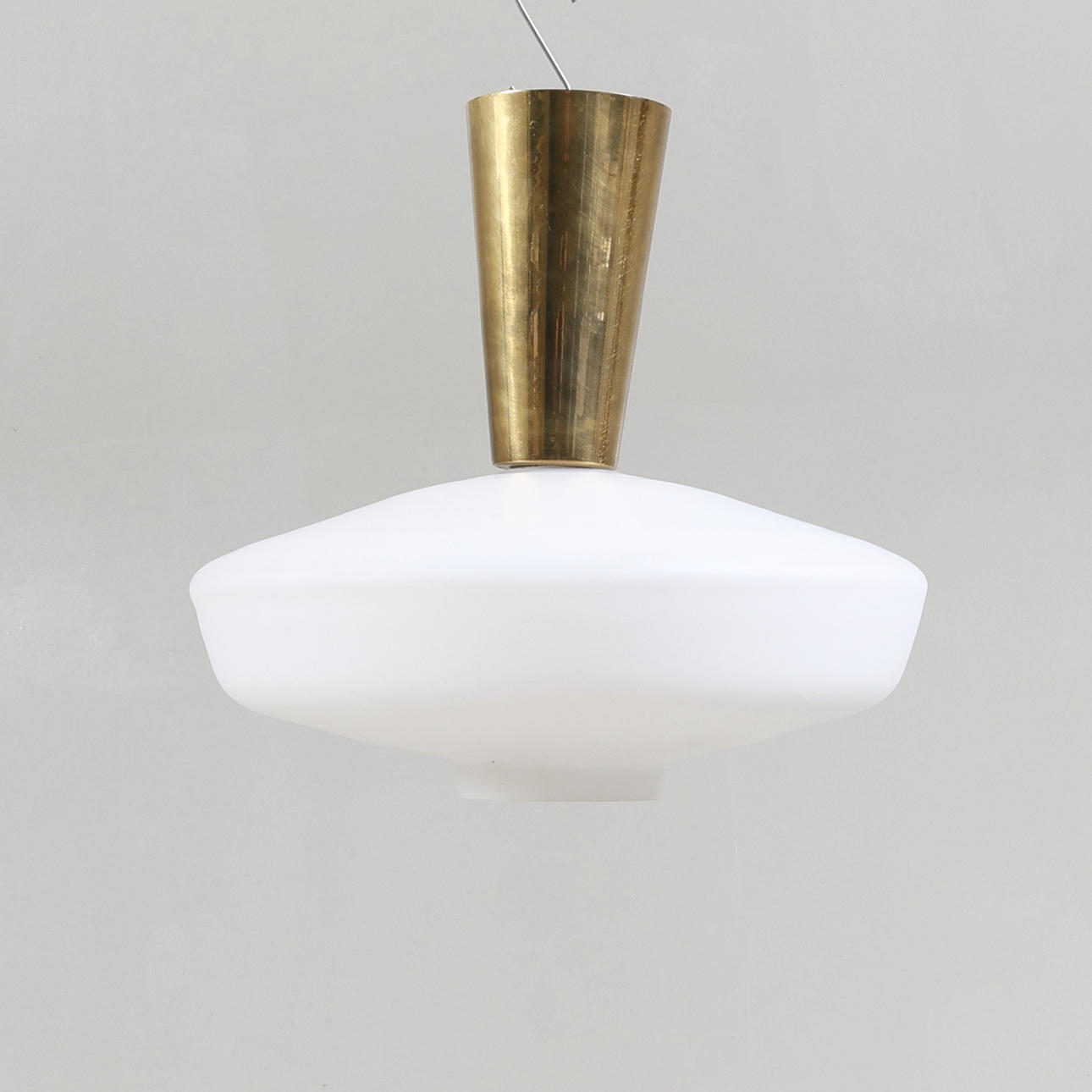 A 1950's opal glass and brass ceiling lamp.