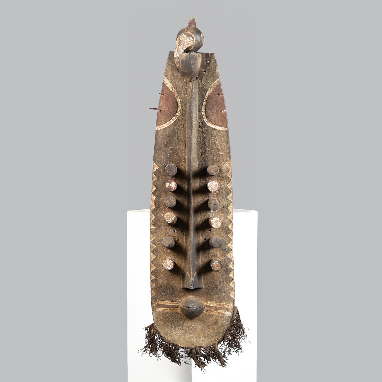 A GREBO ZOOMORPHIC PLANK MASK, LIBERIA.