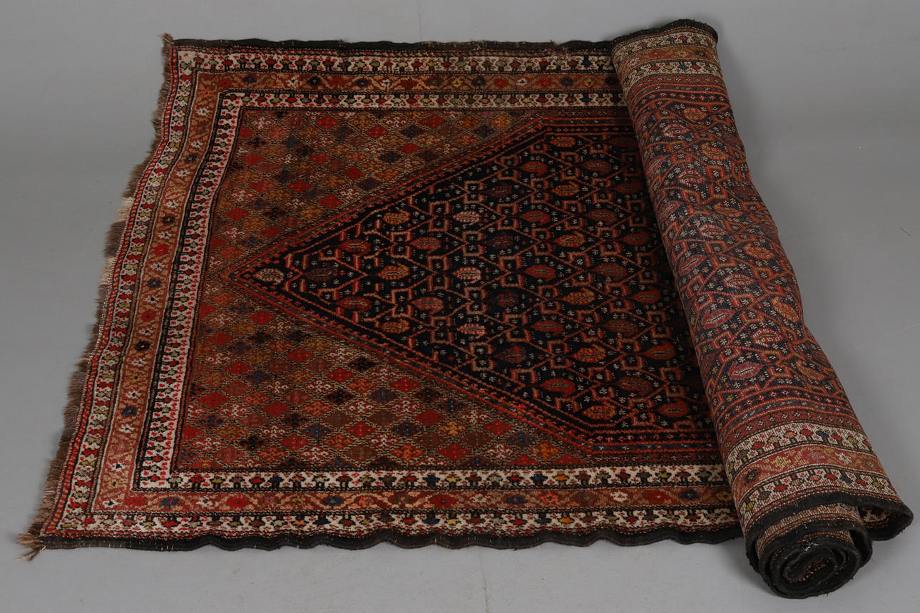 CARPET. Hand-knotted semi-antique herati patterned.