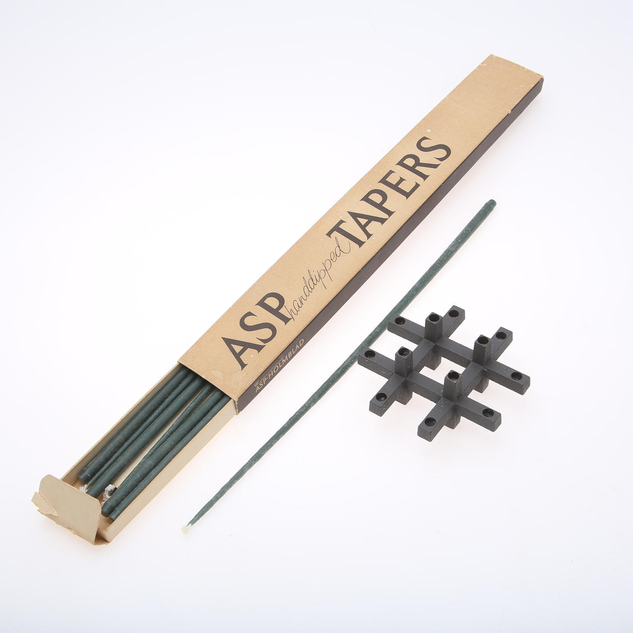 A metal candlestick and a candle, Asp Tapers Stage, ASP-HOLMBLAD, second half of the 20th century.