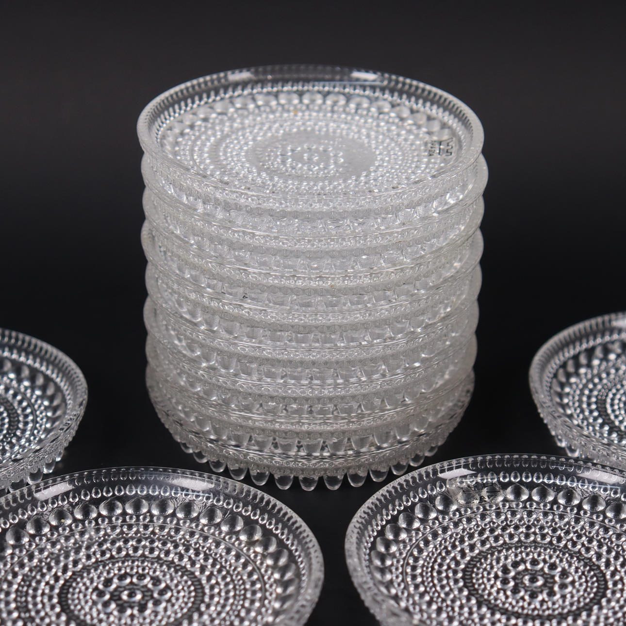 OIVA TOIKKA. Arabia/Iittala, “Kastehelmi”, 12 coasters. Glass