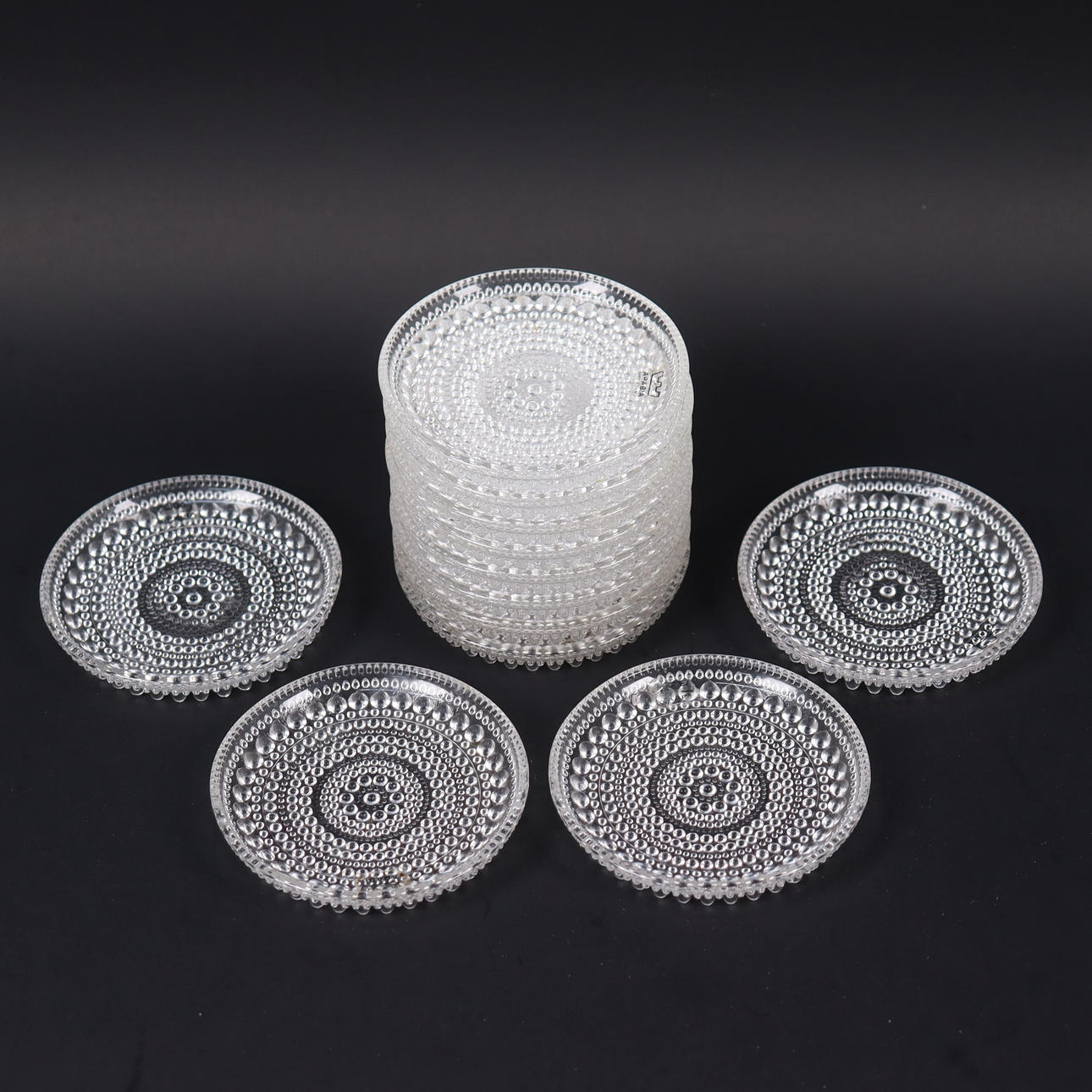 OIVA TOIKKA. Arabia/Iittala, “Kastehelmi”, 12 coasters. Glass