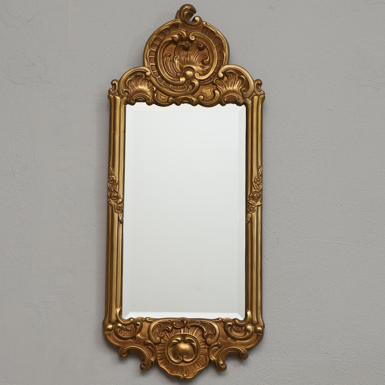 A 20th century gold-coloured mirror.
