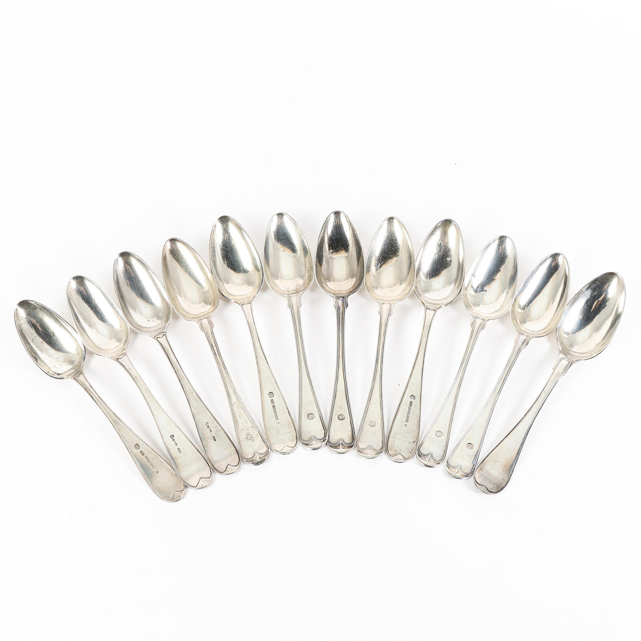 12 silver dining spoons, 19th century.