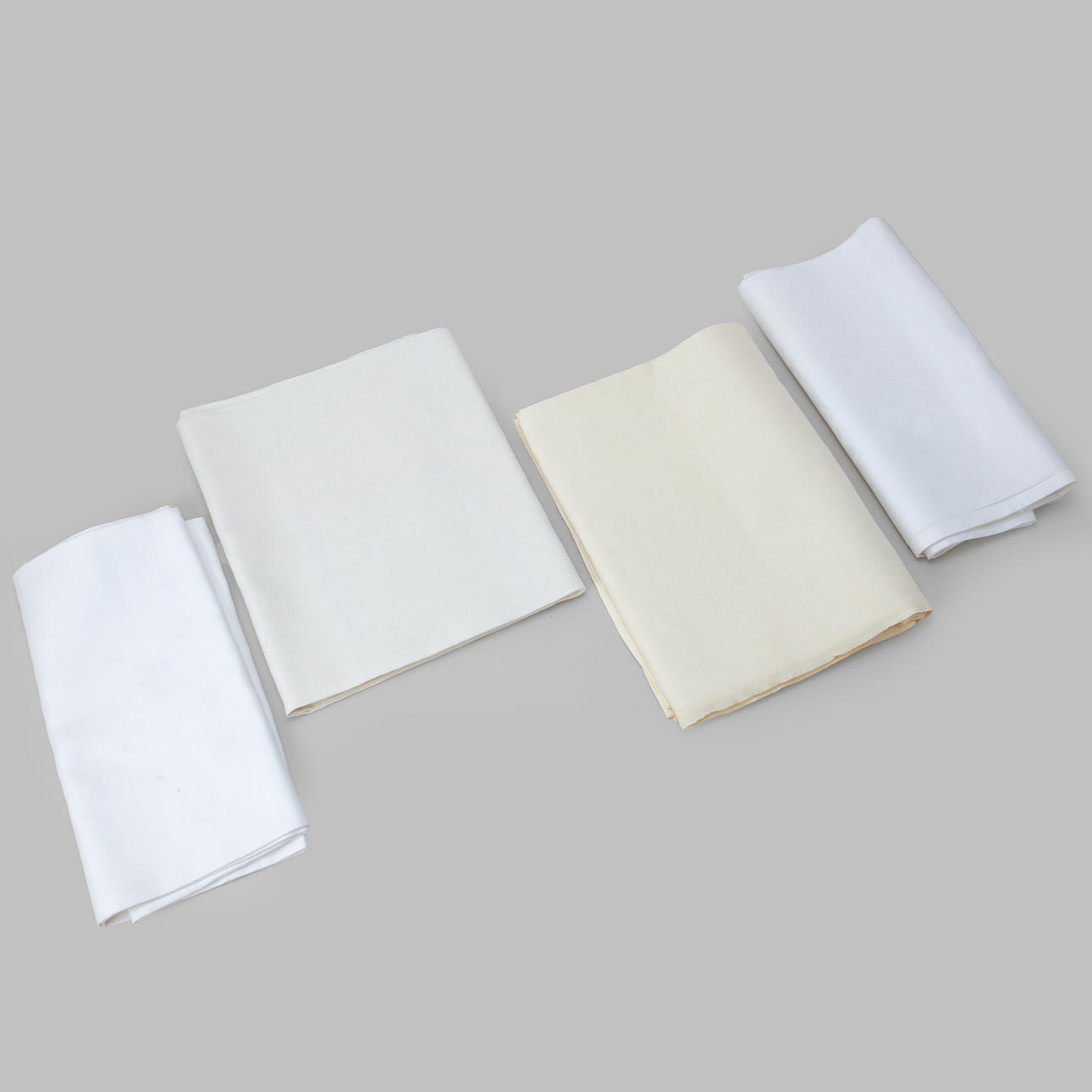 A set of 4 linen damask tablecloths.