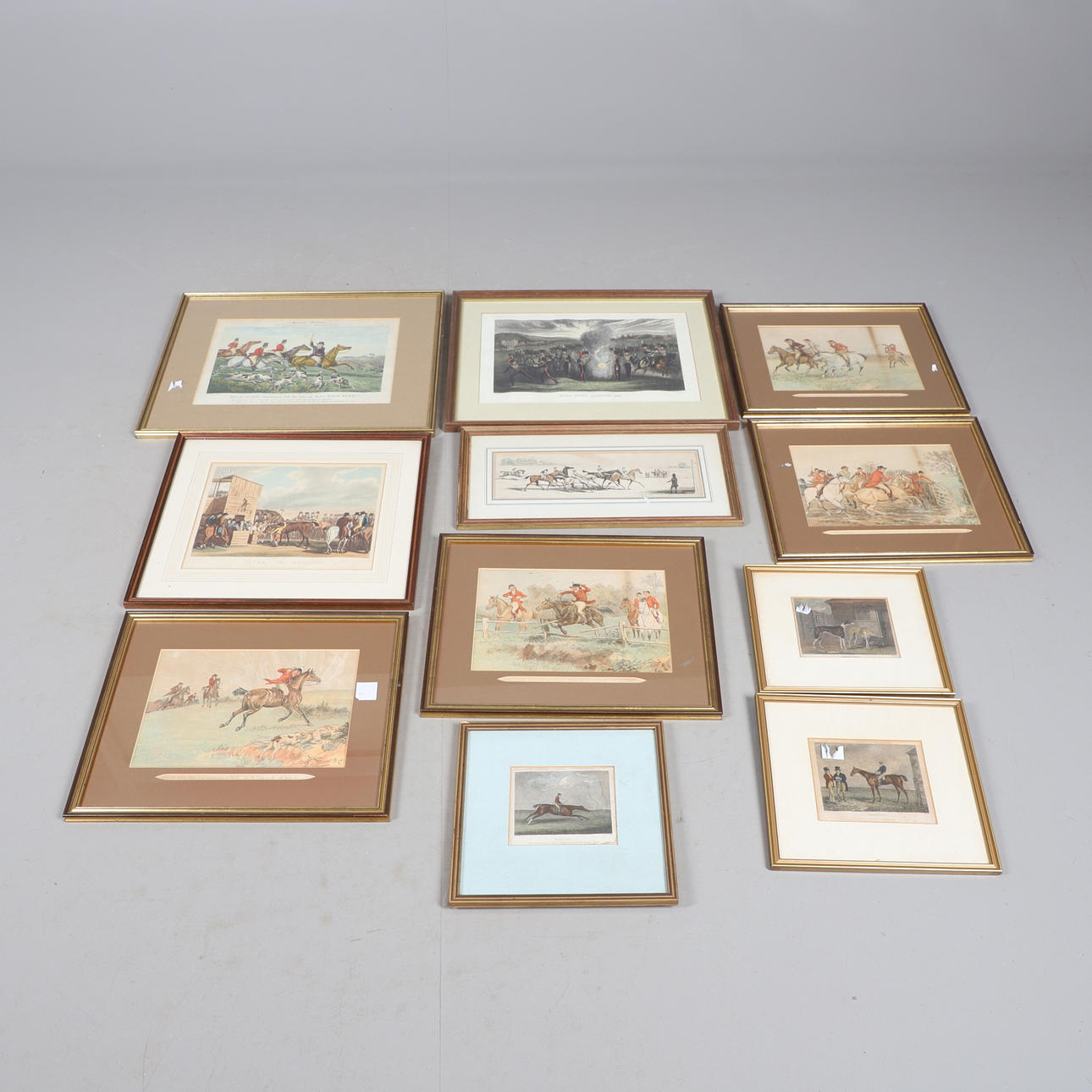 ELEVEN ASSORTED SPORTING & MILITARY PRINTS.