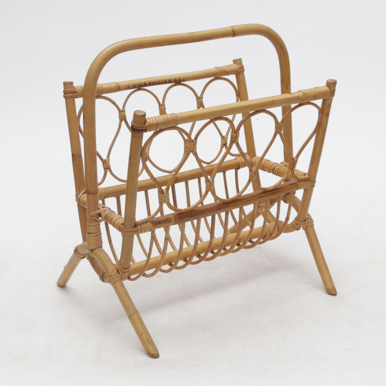 A rattan magazine rack.