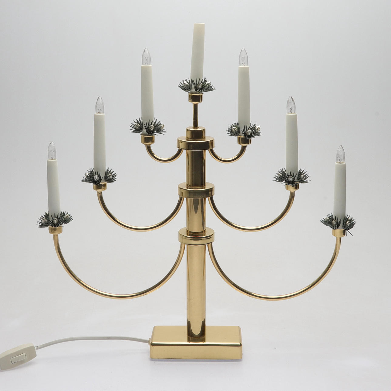 An electric candlestick, brass, Konstsmide, 2000s.