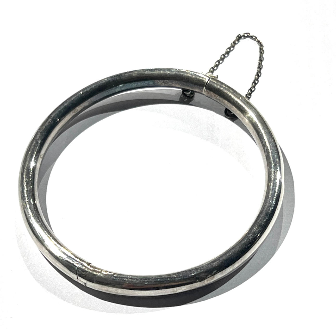 Silver slave bracelet. With safety chain.